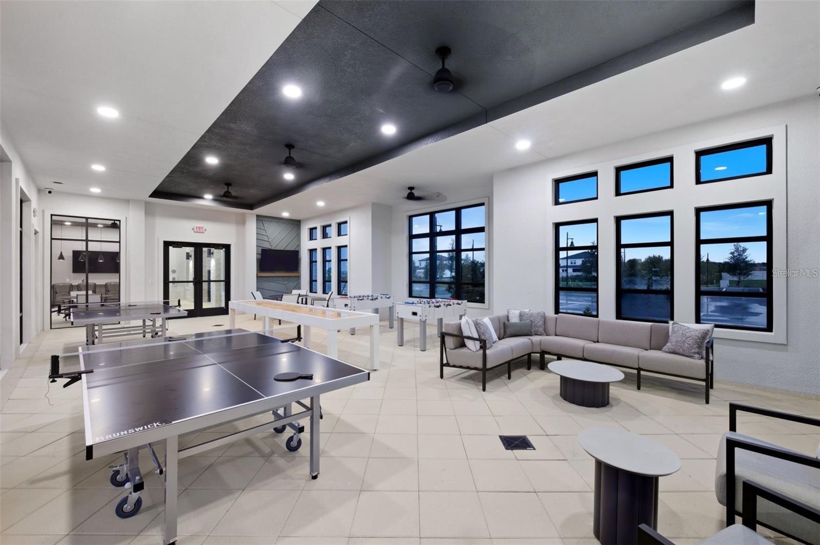 Bright clubhouse interior with room for events, relaxing, and neighborhood gatherings.