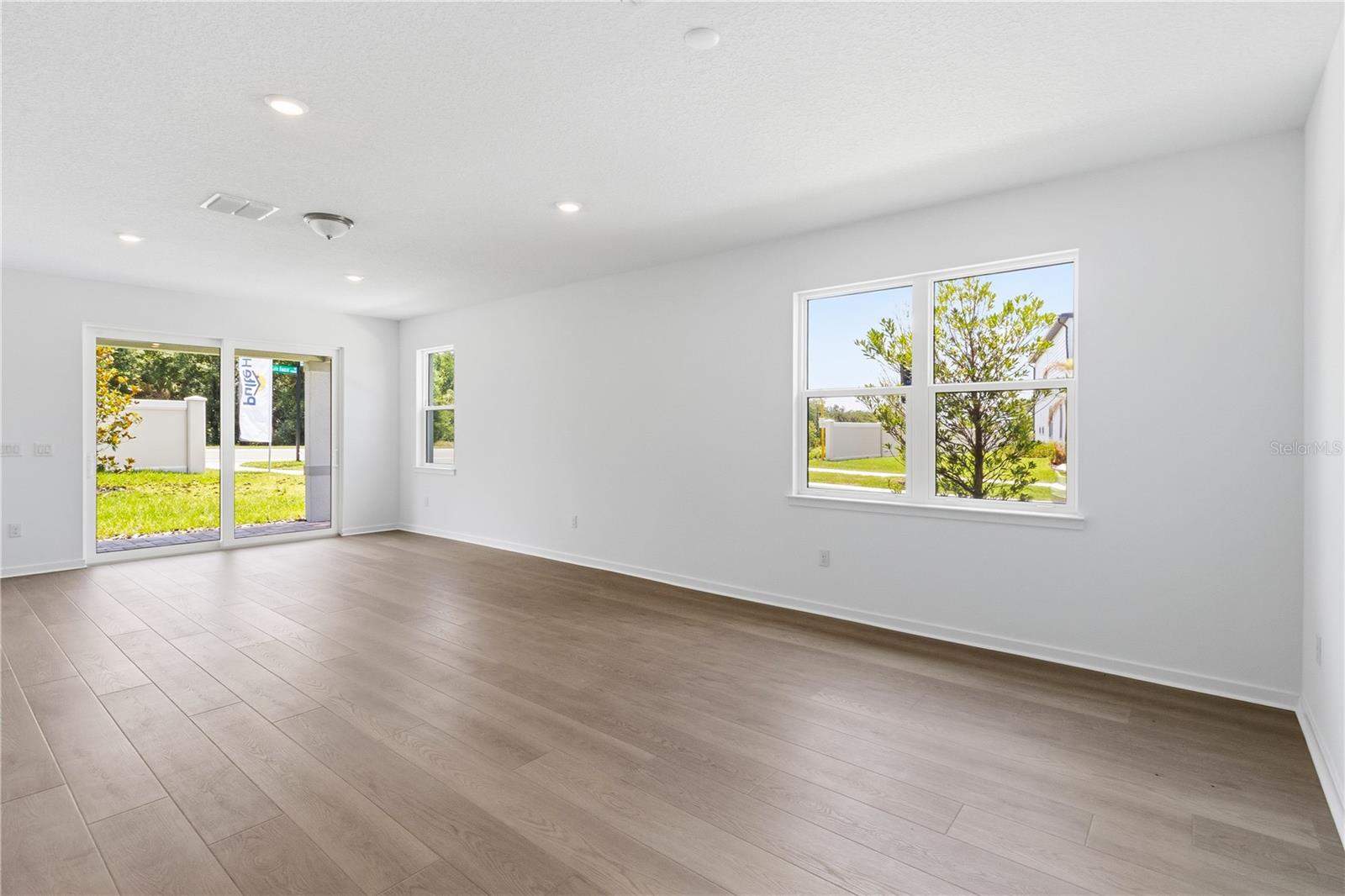 Open gathering room with natural light and flexible space for everyday living.