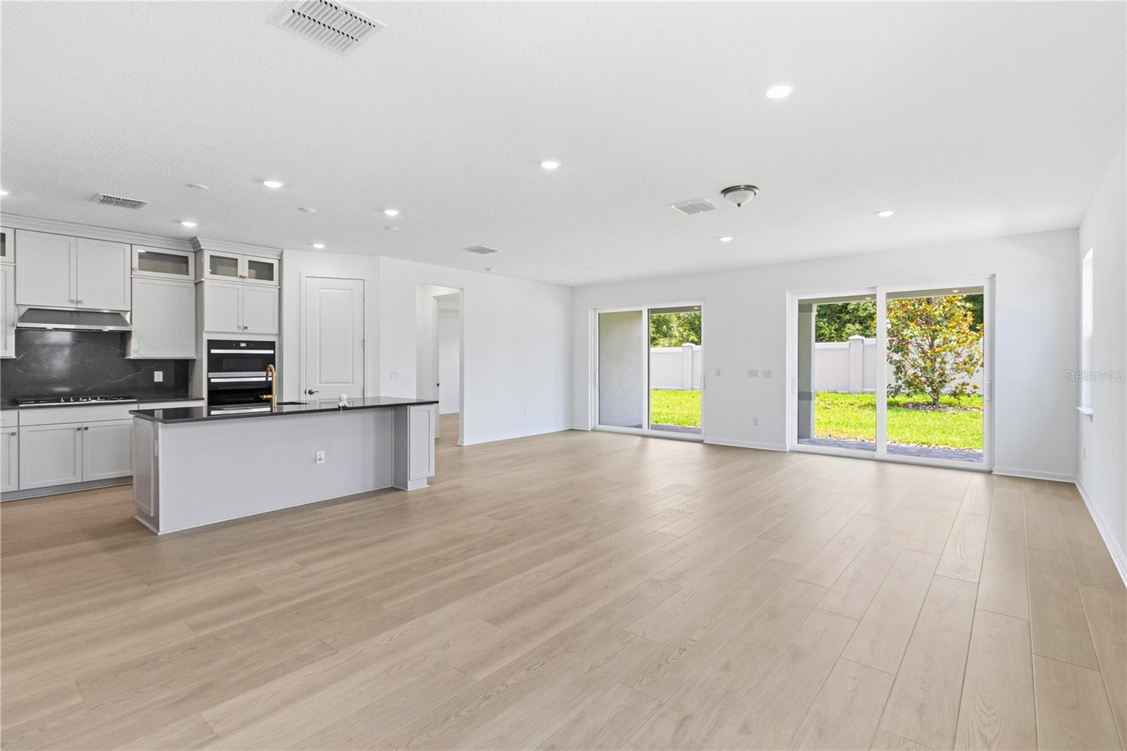 Bright main living area connected to the kitchen for easy conversation and flow.