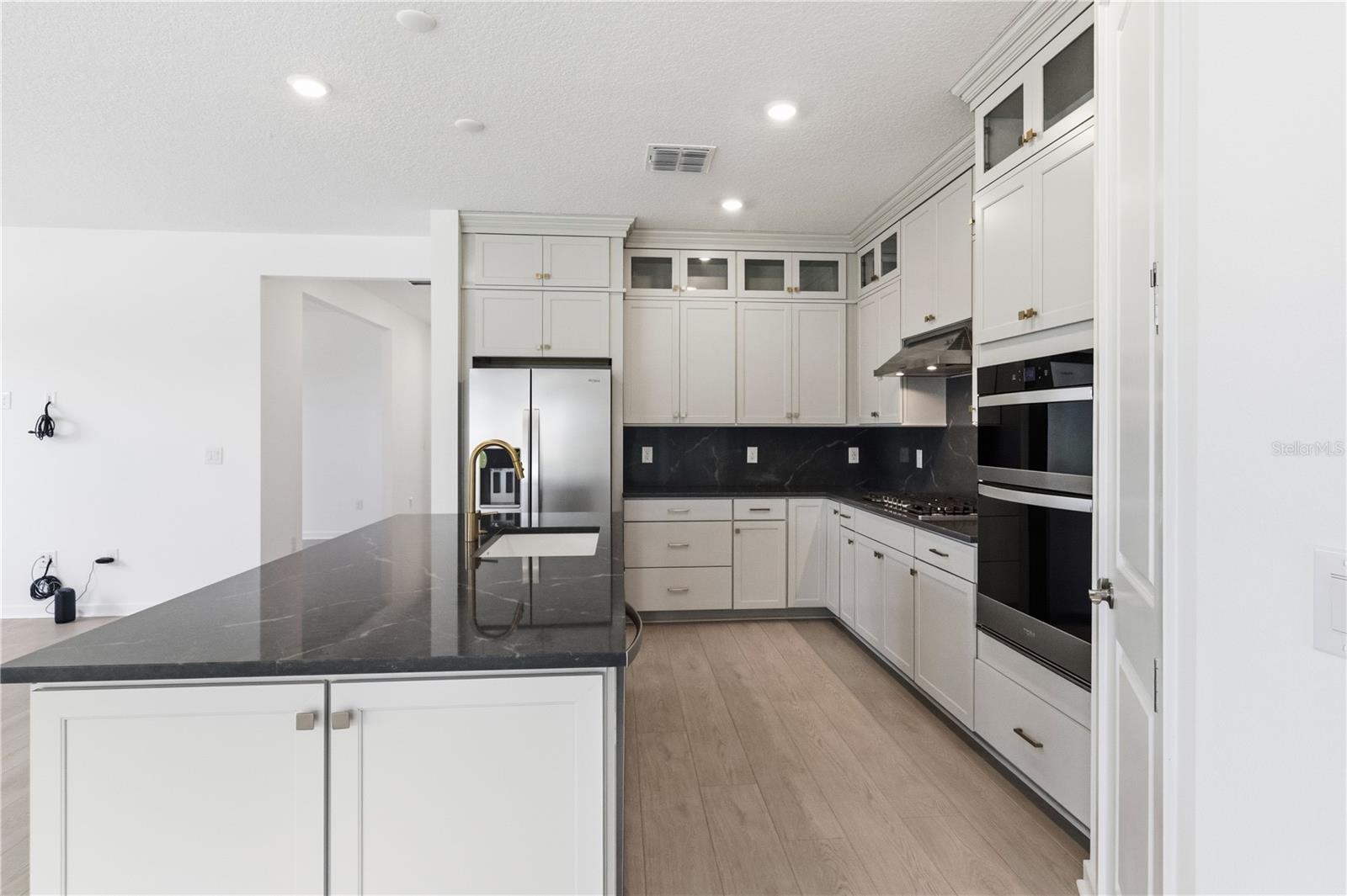 Beautiful kitchen with a large island, upgraded finishes, and plenty of workspace.