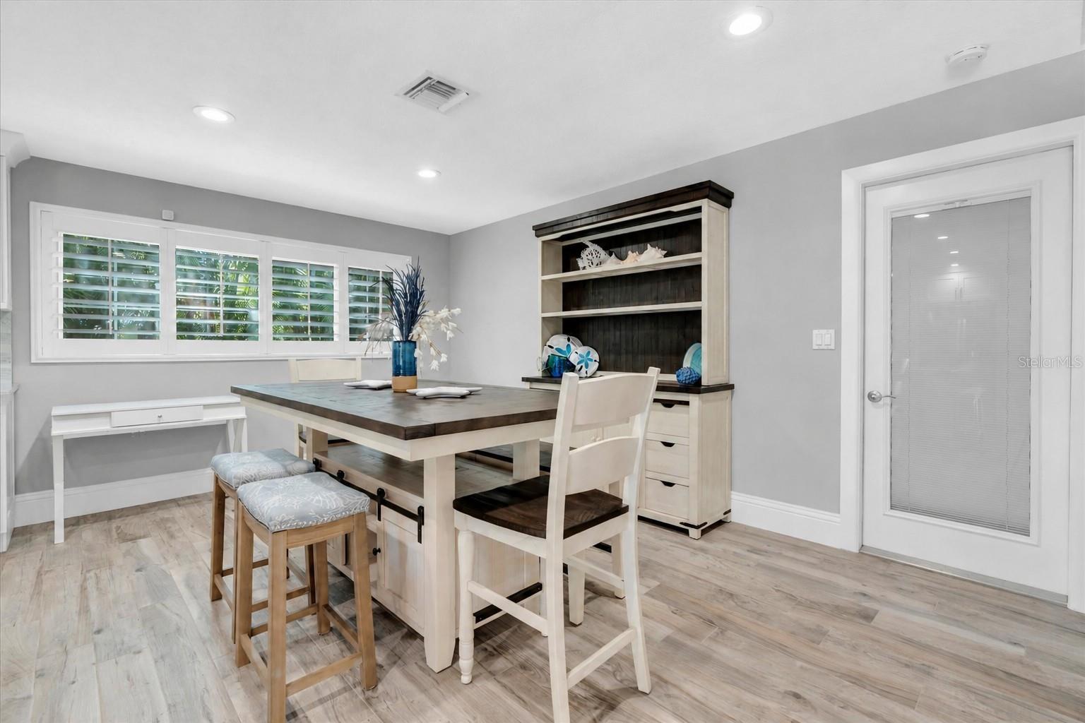 Planked tile flooring throughout.