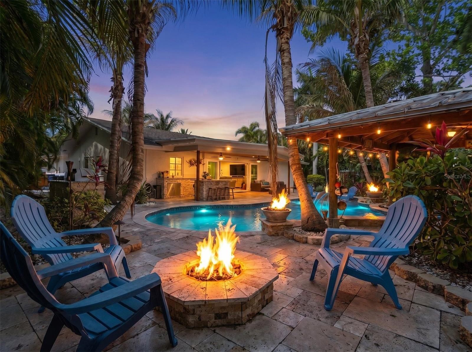 Evenings come alive with glowing water and firelight. Firepit for another cozy spot.