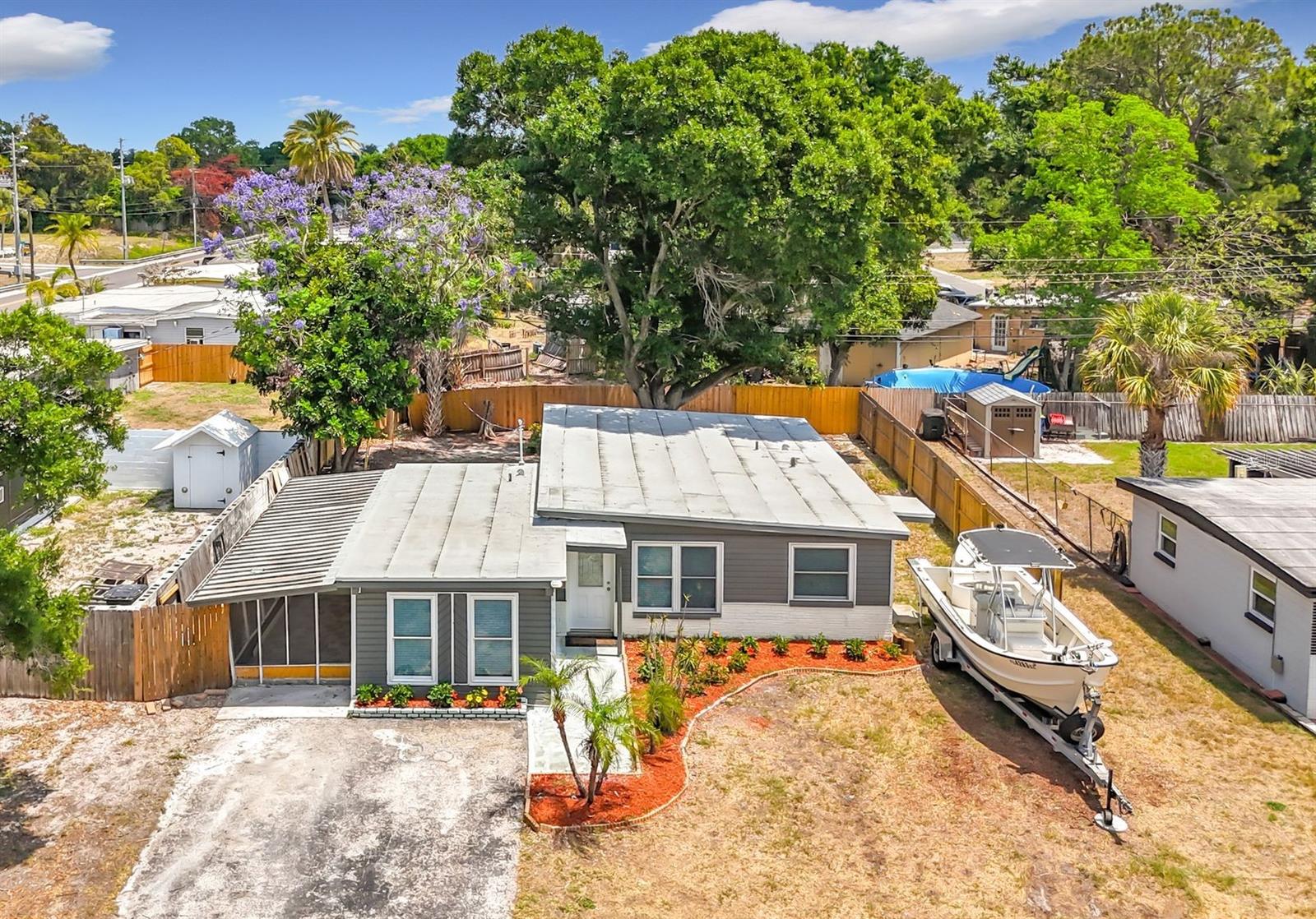 Completely renovated block home offering 4 bedrooms and 2.5 baths, ready for immediate move-in. NEW ROOF (2026) and hot water heater (2026), plus an extended double driveway with ample space for cars, RVs, or boats. NO FLOOD ZONE, NO HOA, NO CDD!