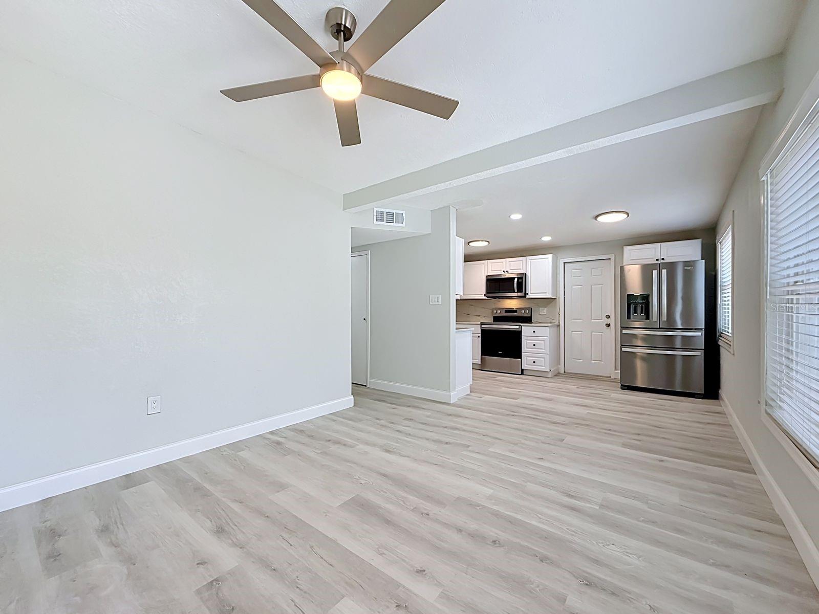 Open Floor Plan - View from living room into dining area and kitchen
