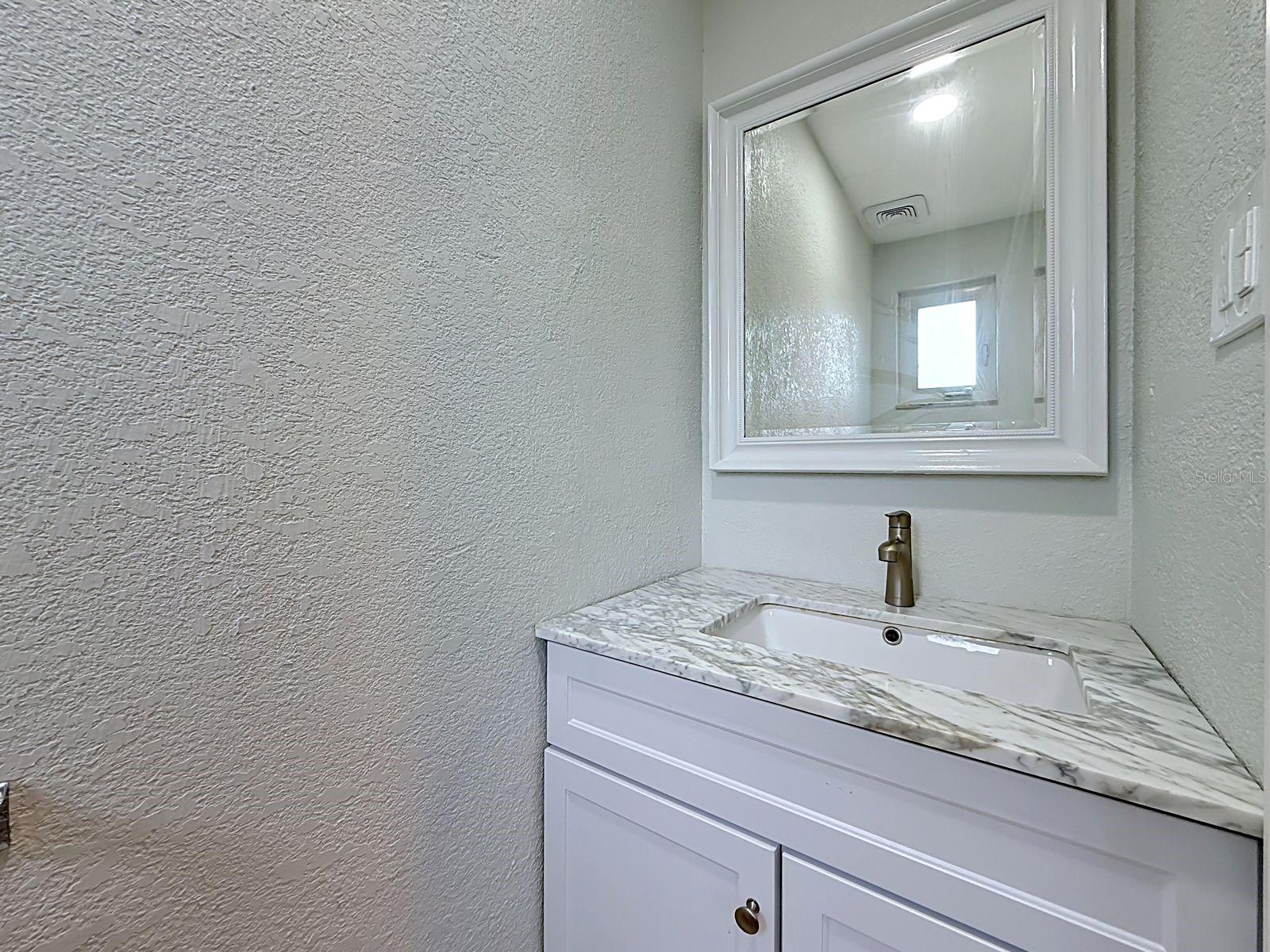 4th Bedroom's private water closet (toilet/vanity/sink)