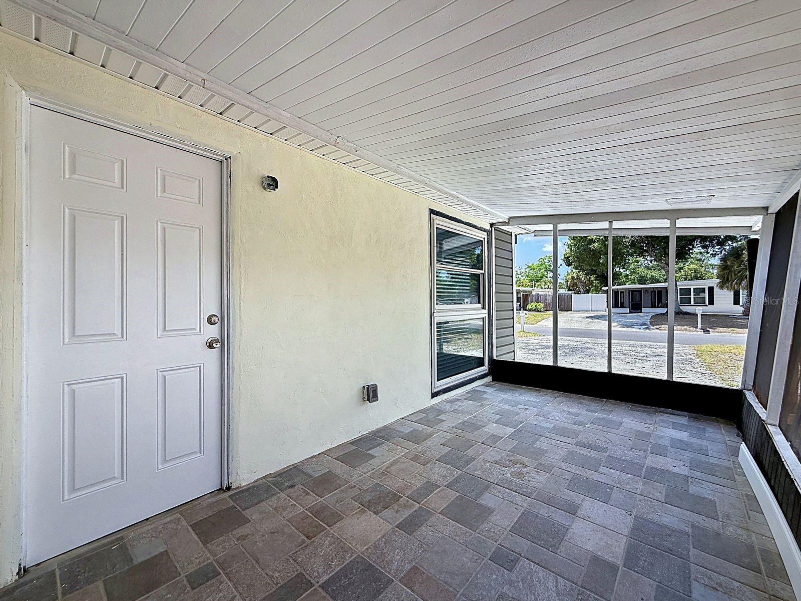 Screened-In Patio includes a separate storage room, perfect for additional storage or a workshop
