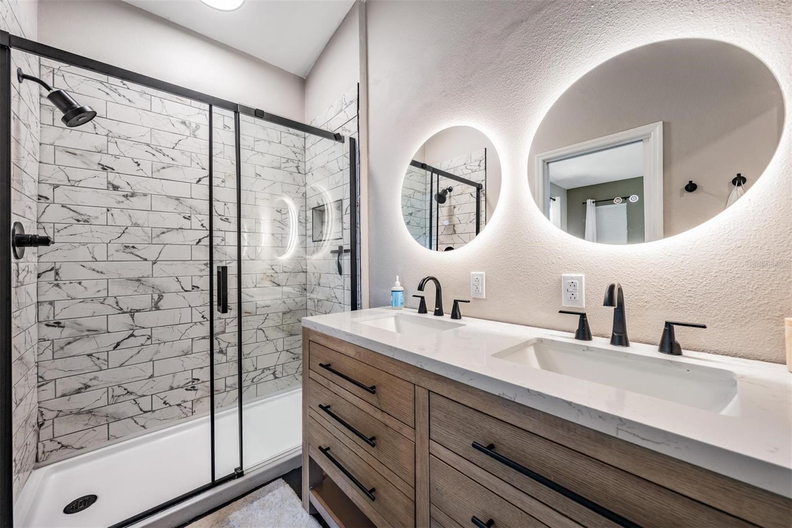 Luxurious Ensuite bath with gorgeous shower and dual sinks