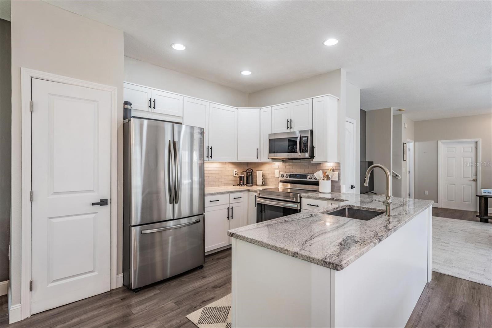Upgraded countertops with an abundance of cabinets