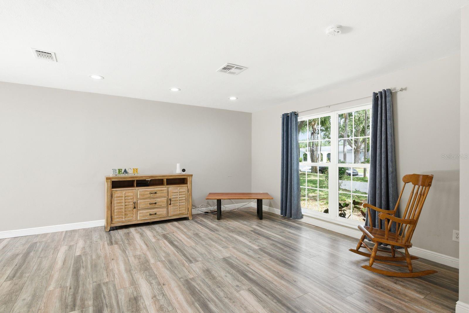 Natural light flows into the living room