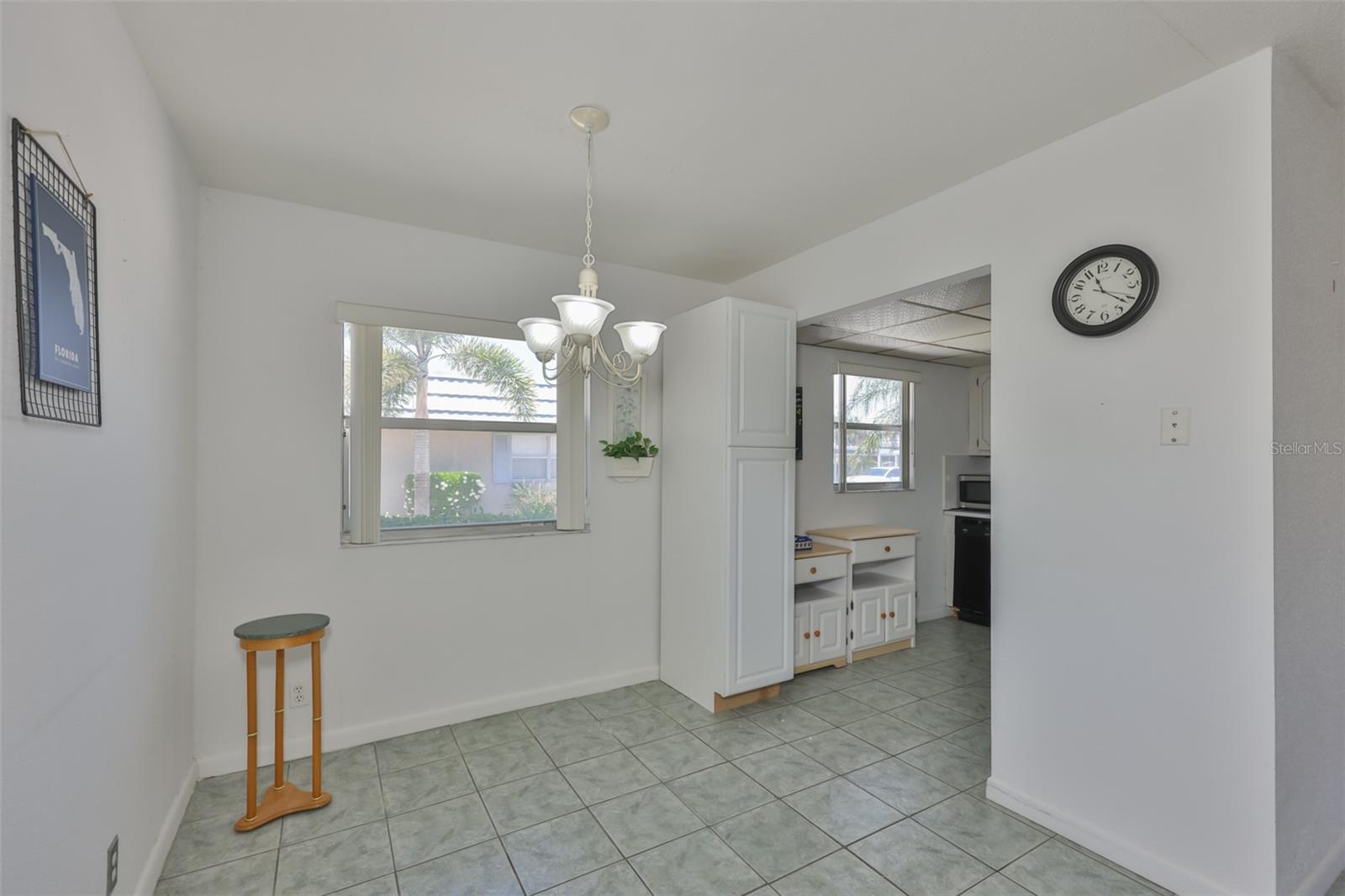 VIEW OF DINING AREA FROM FRONT DOOR.