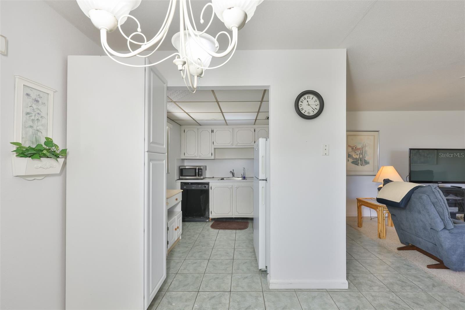 LONG SHOT OF KITCHEN FROM FRONT DOOR