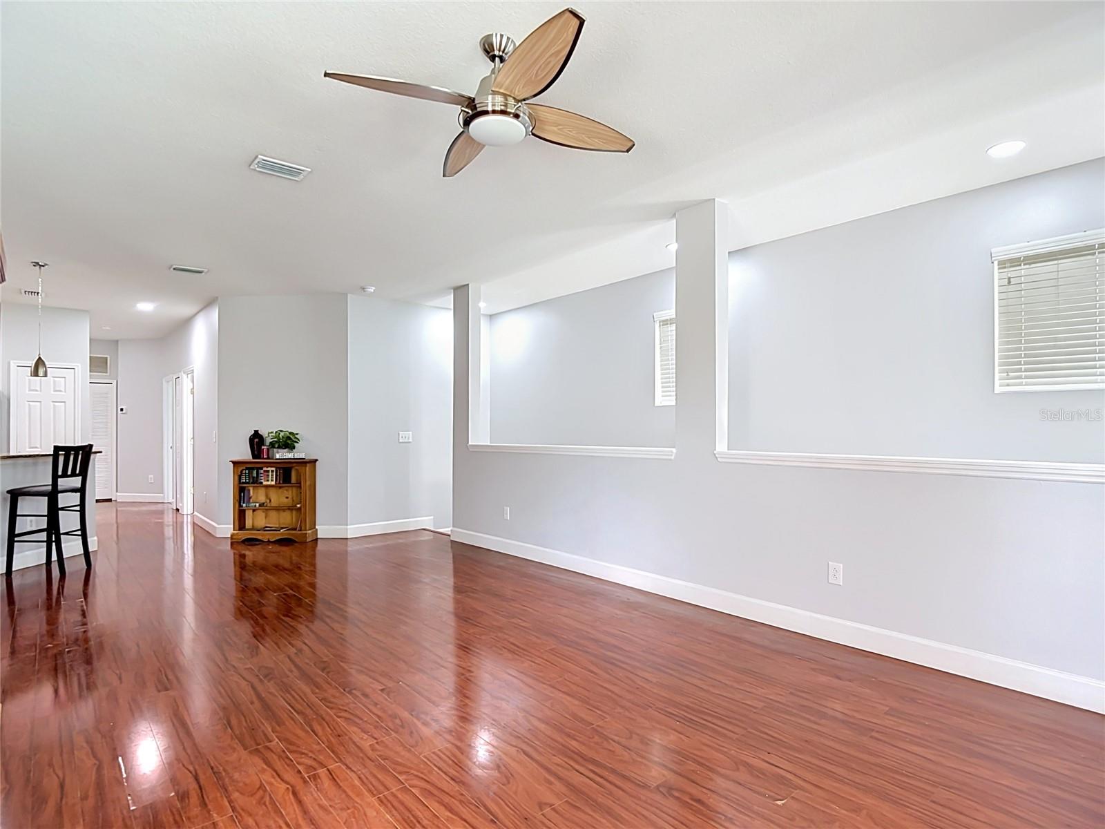9502 W Park Village 108, Great Room view showing front entry stairwell to right, kitchen to left
