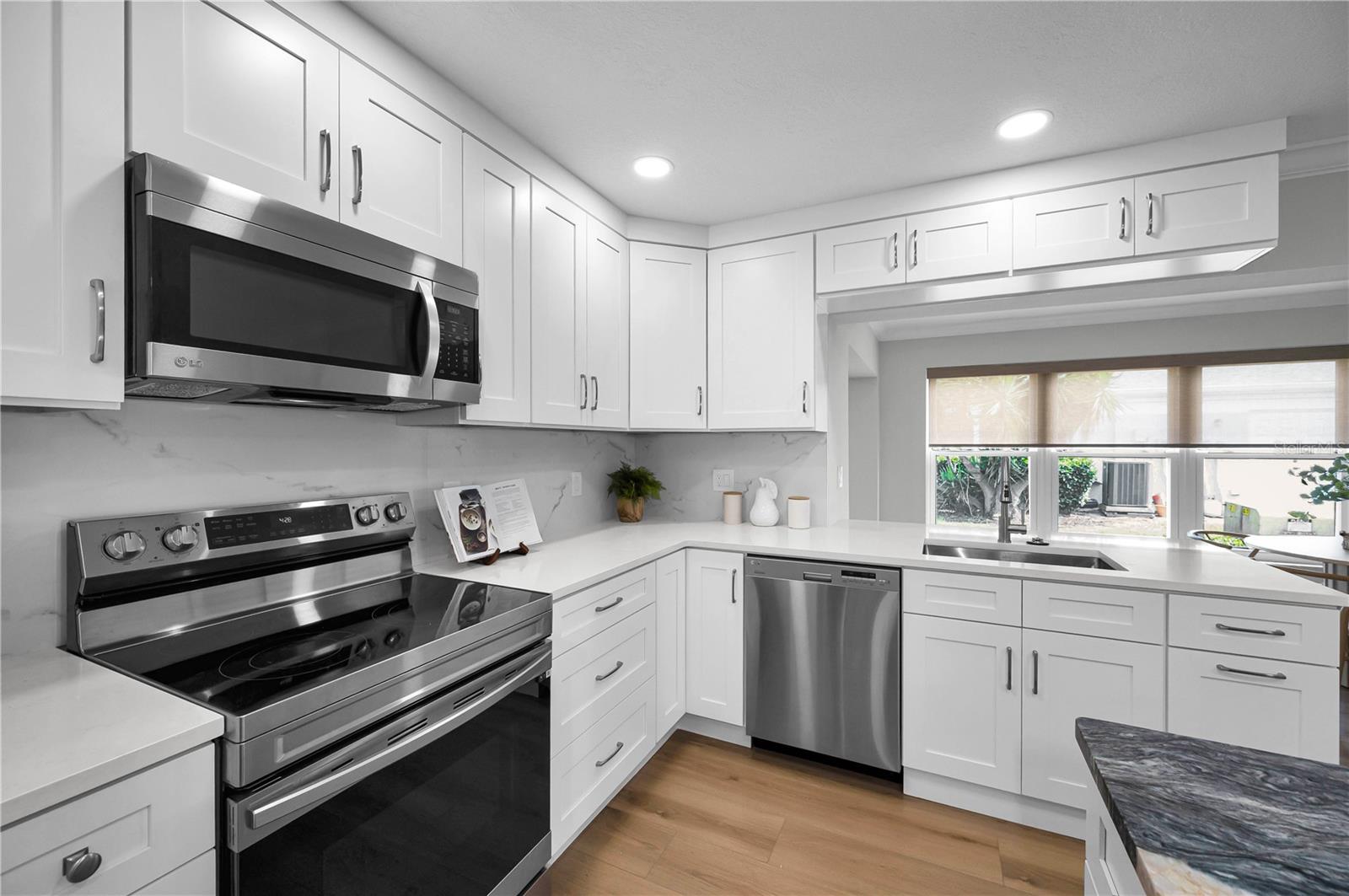 Plenty of counter space here and this backsplash is so pretty!