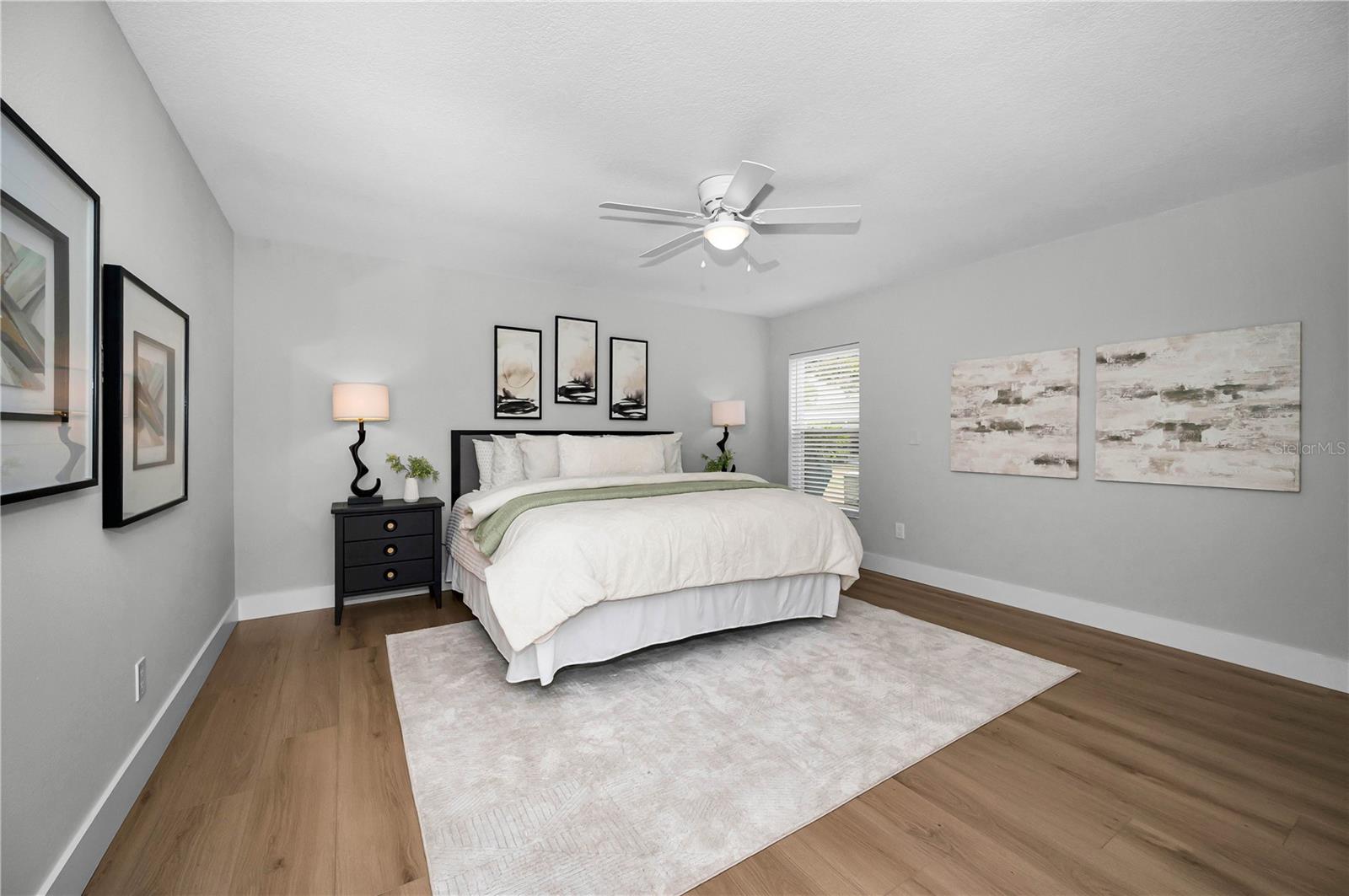 Plenty of room for a king size bed in this primary suite.