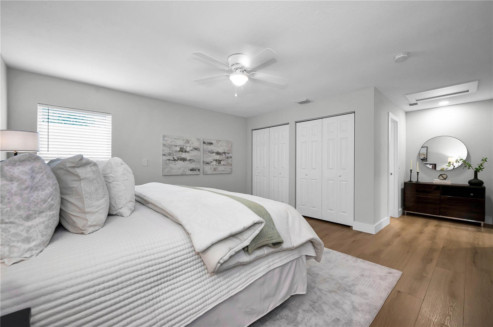 Primary suite offers ample closet space plus a dressing area adjacent to primary bath.