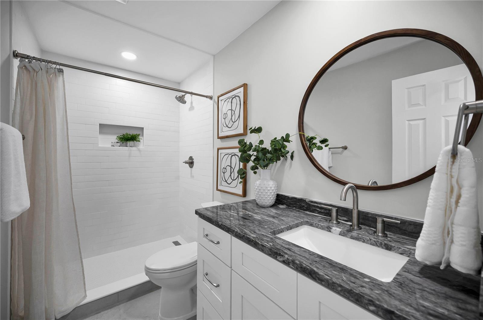 Primary bath offers modern amenities.