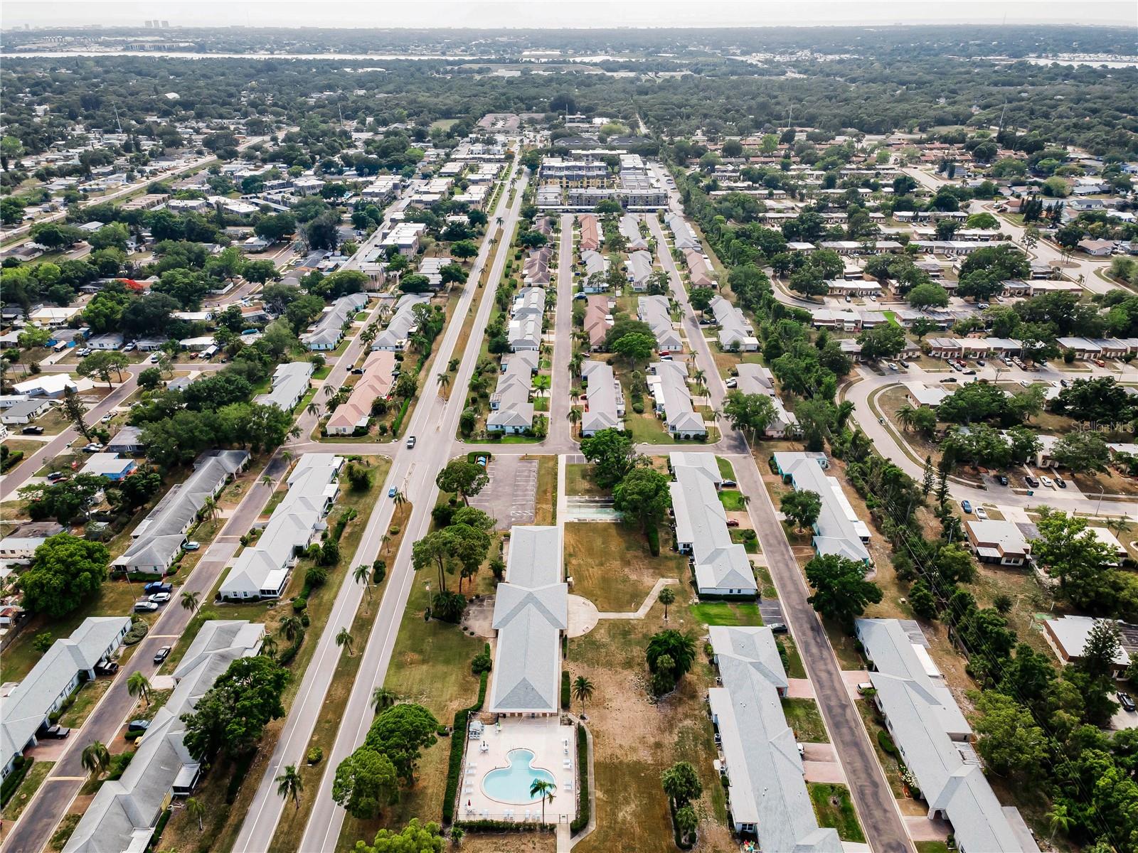 Aerial view of pool and rec area while looking west towards Lake Seminole.