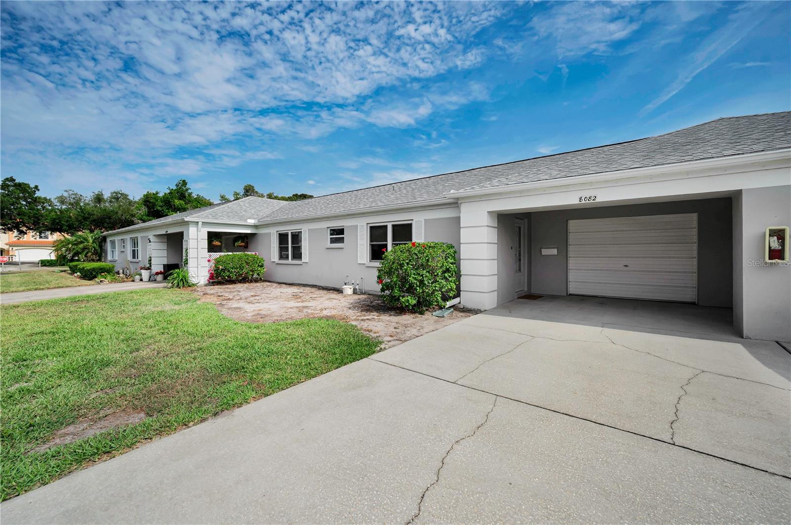A covered entry with garage access only steps apart. HOA has established they will replace sod once SWFWMD restrictions have been lifted.