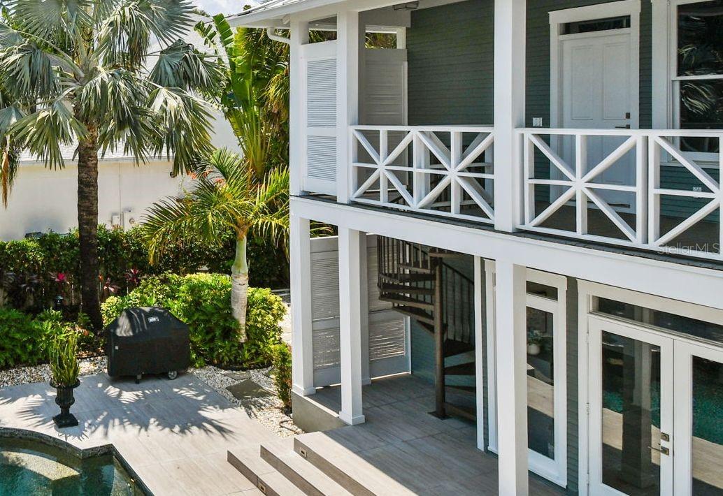 The circular stairway is way to the 2nd floor of the guest wing from the exterior.  The second way is from the primary bathroom along the covered porch on the second floor.