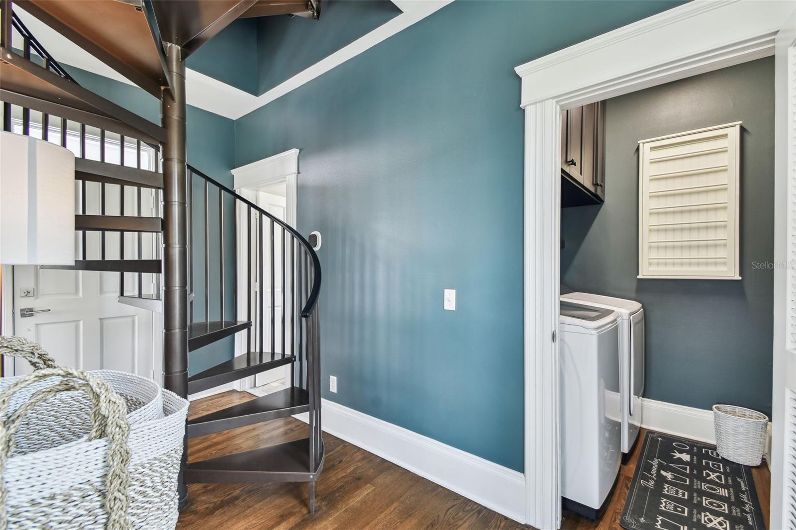 Staircase to the window's walk.  Door to the laundry is open to the left.