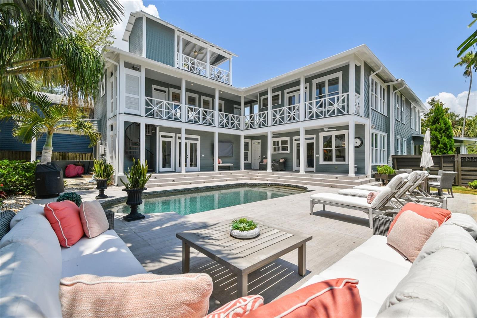 Looking from the southwest corner of the pool deck.  Note the covered storage/gardening area against the guest wing on the left.