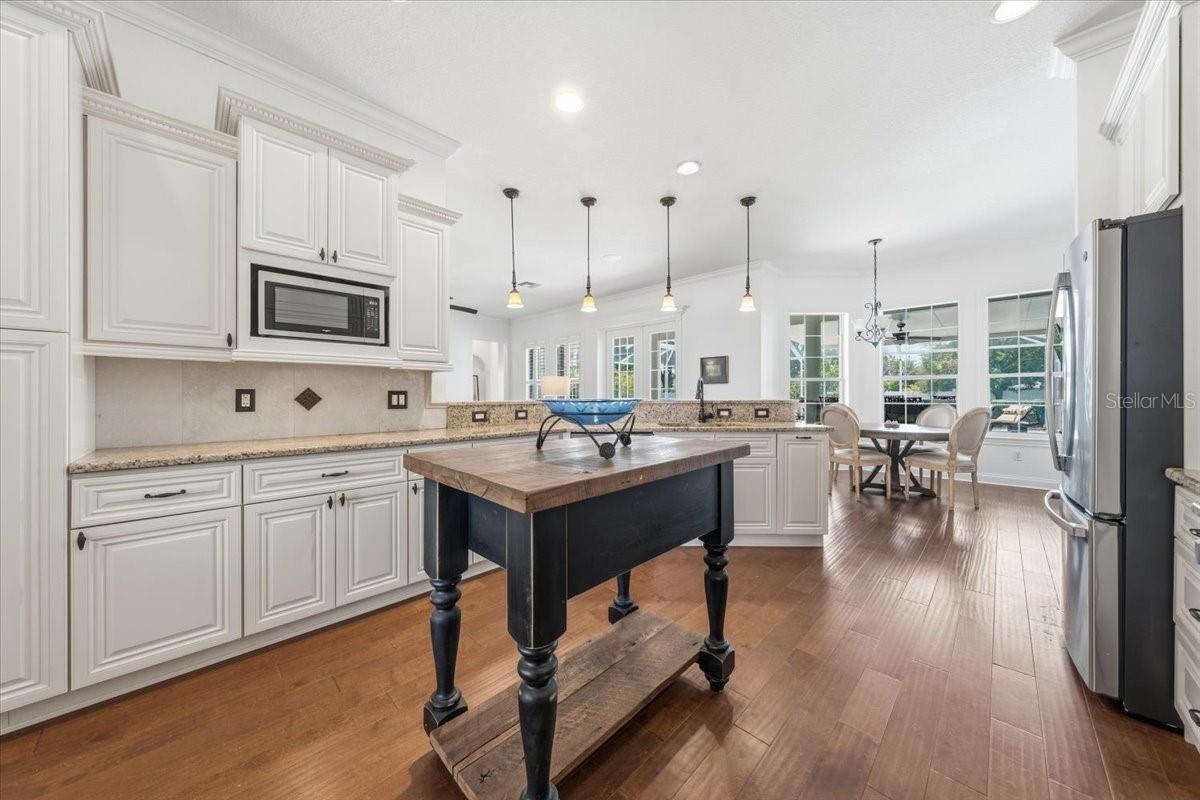 Open-concept connection to living and entertaining spaces
