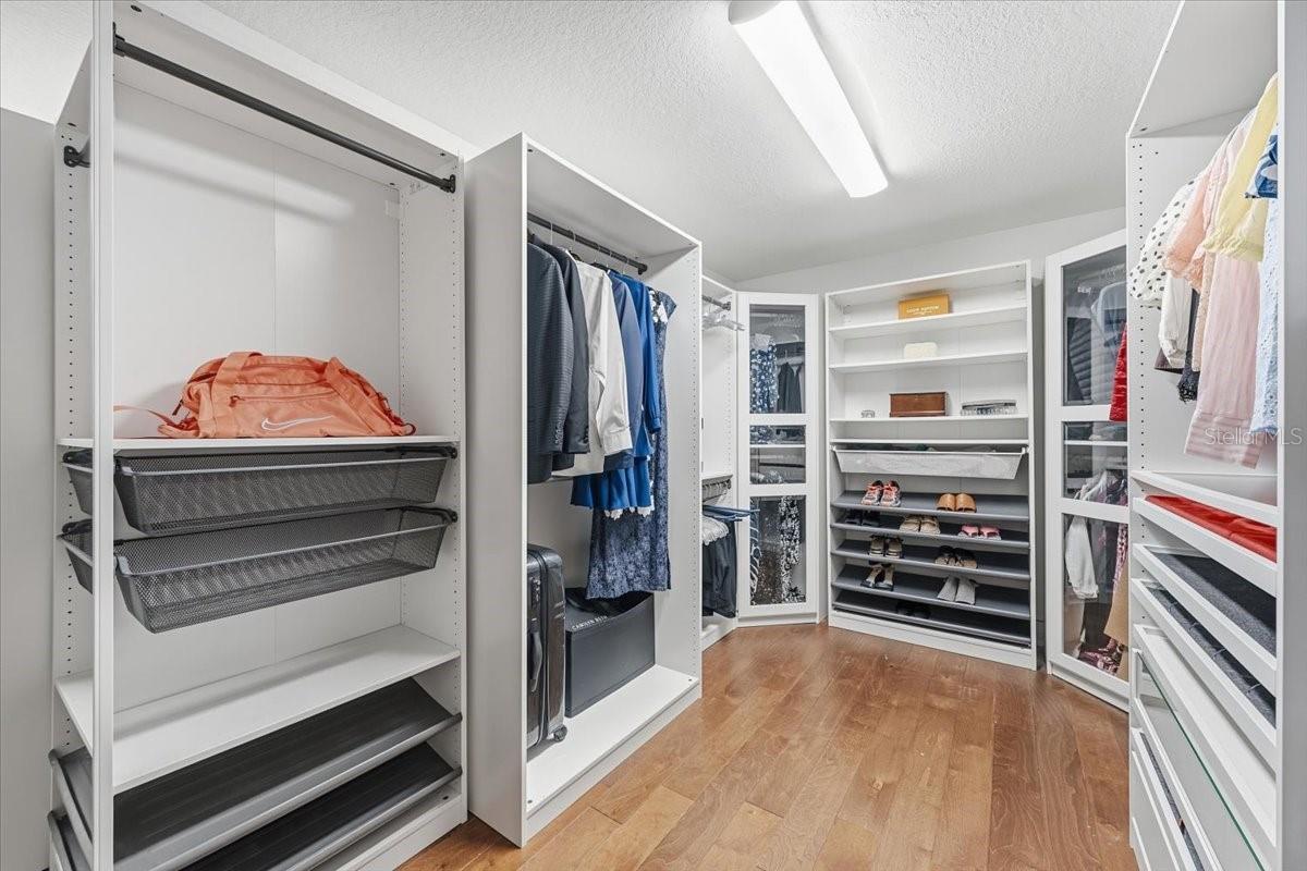 Custom-designed walk-in closet with extensive organization space