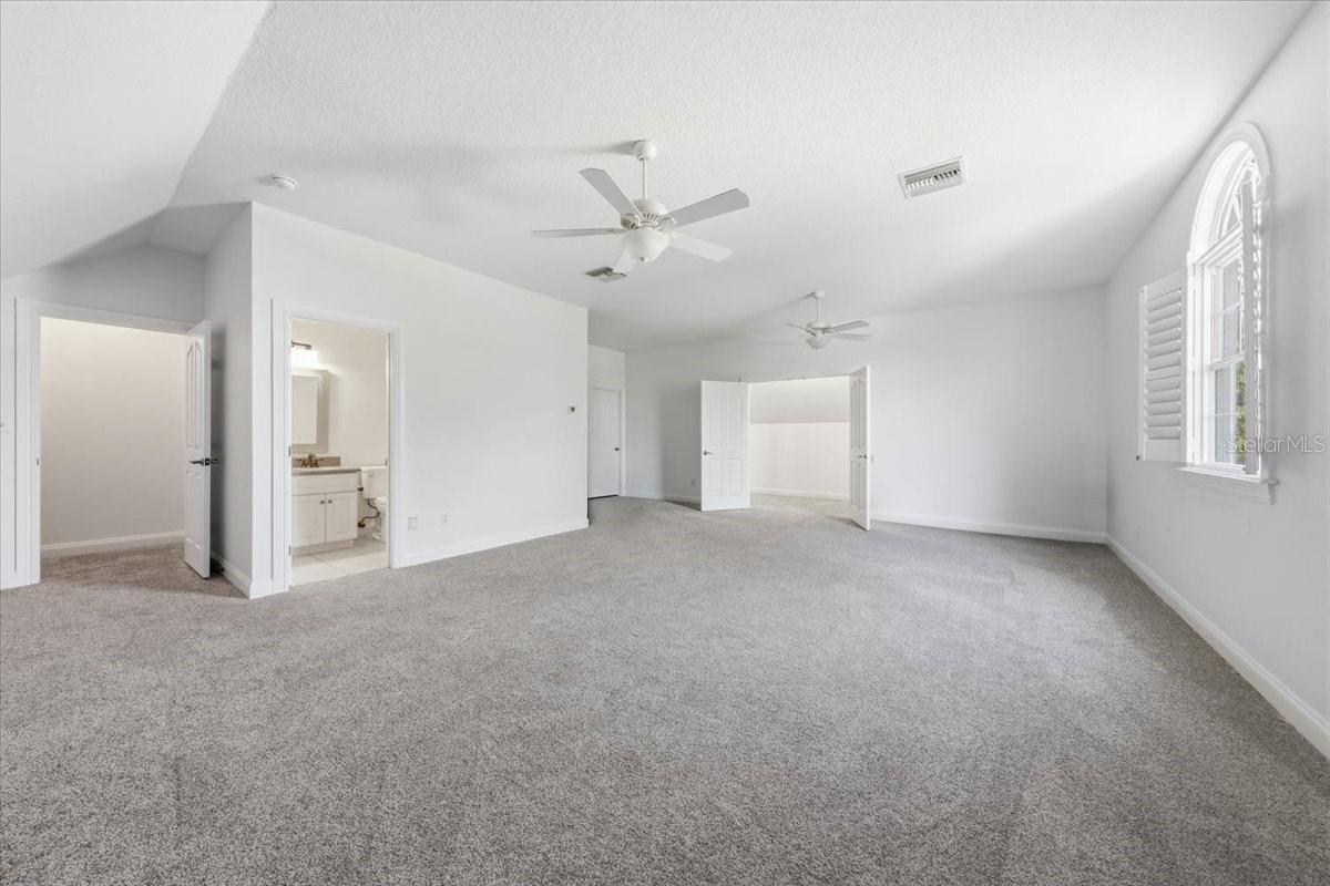 Expansive upstairs bonus room with half bath