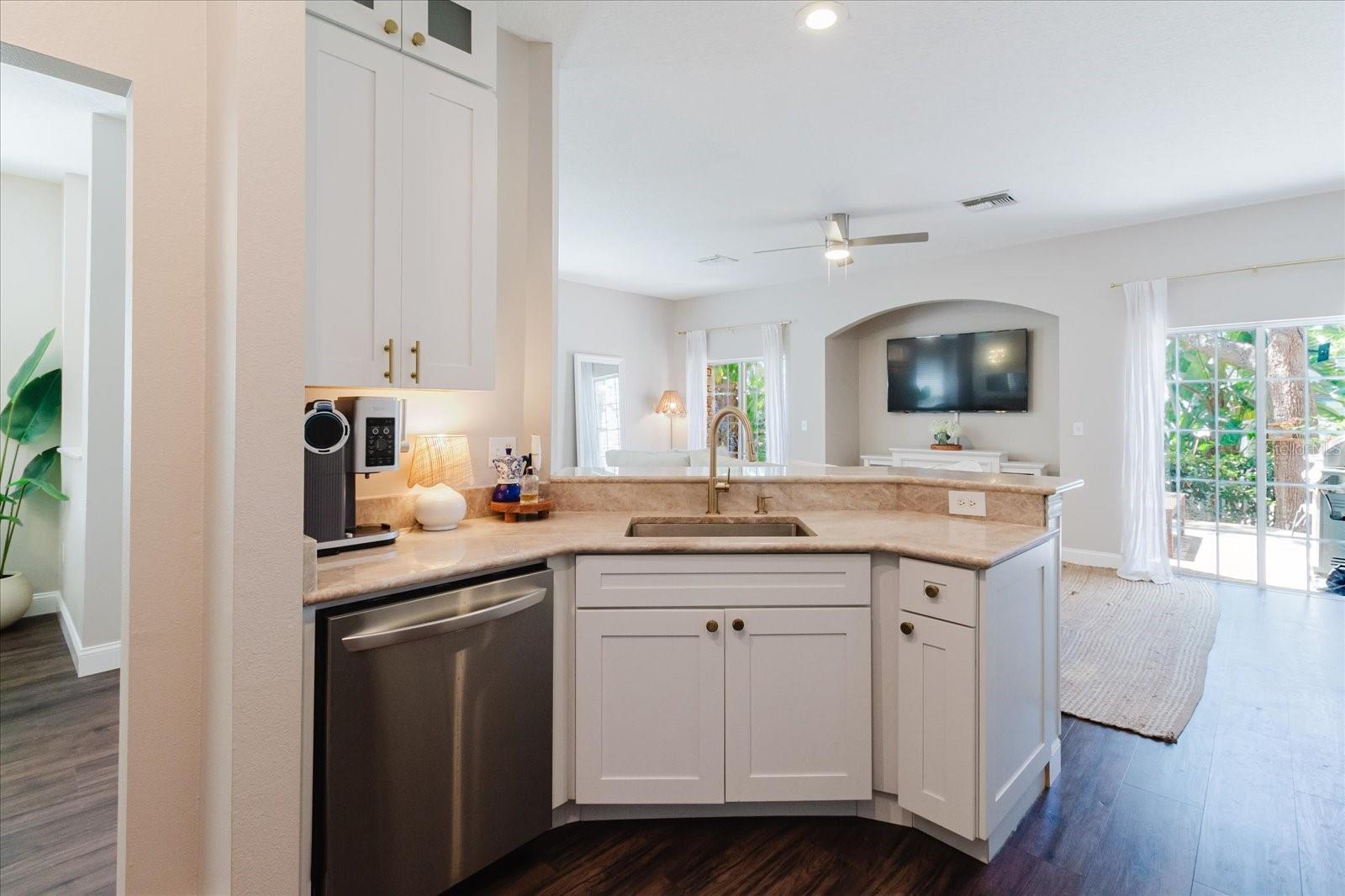 Standing At Kitchen Sink Overlooking the Living Room