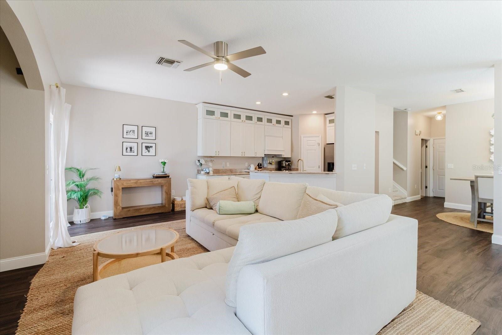Open Concept Main Living Area With Luxury Vinyl Floors. Two Sliding Glass Doors That Lead To The Deck.