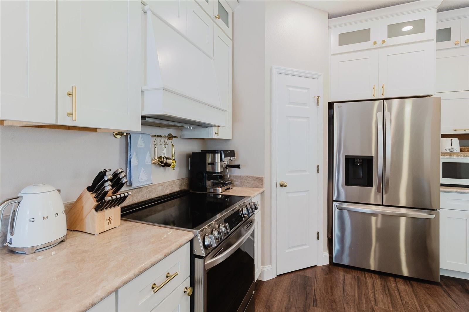 Updated Kitchen With Quartzite Counters, Stainless Steel Appliances That Stay, Luxury Vinyl Floors