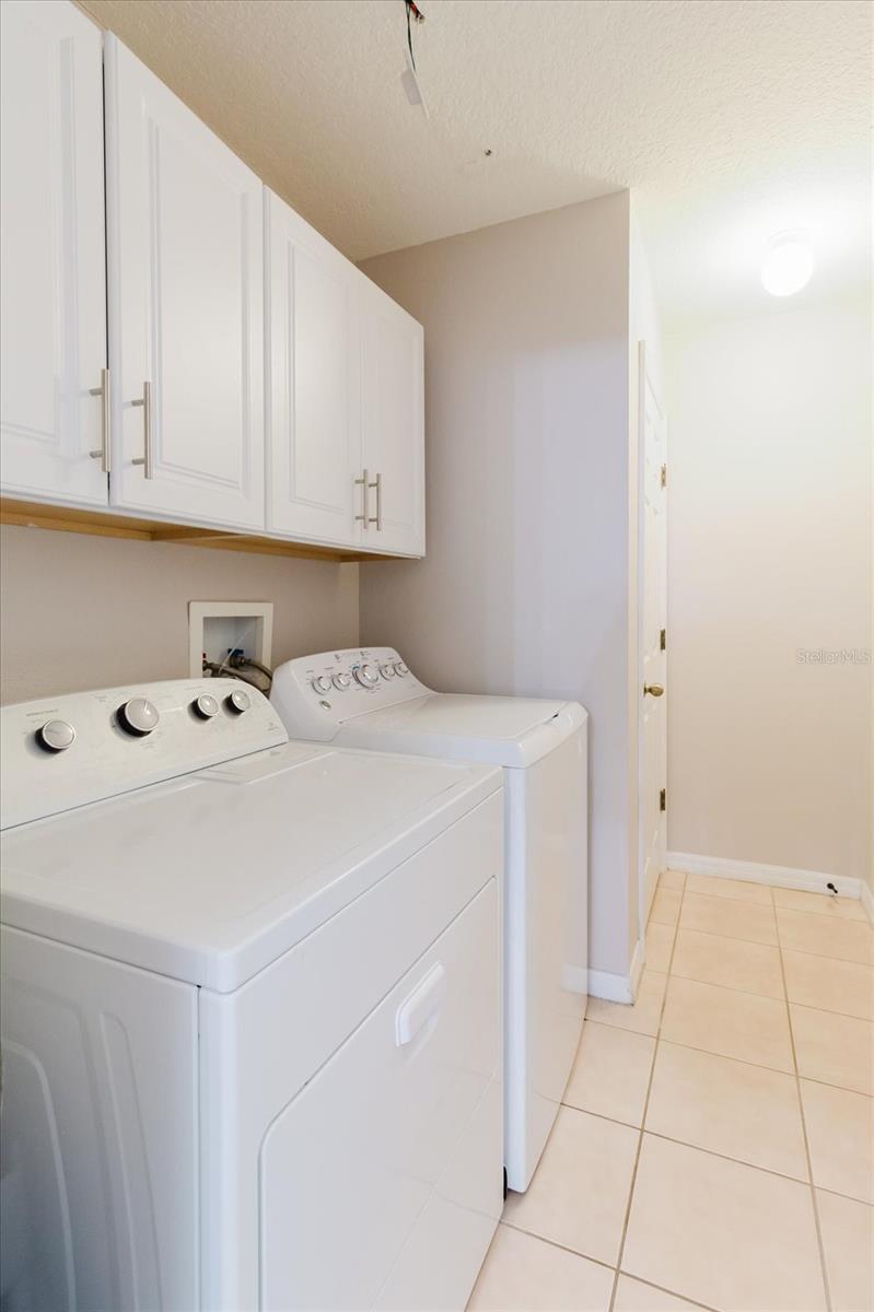 Laundry Room With Washer & Dryer That Conveys