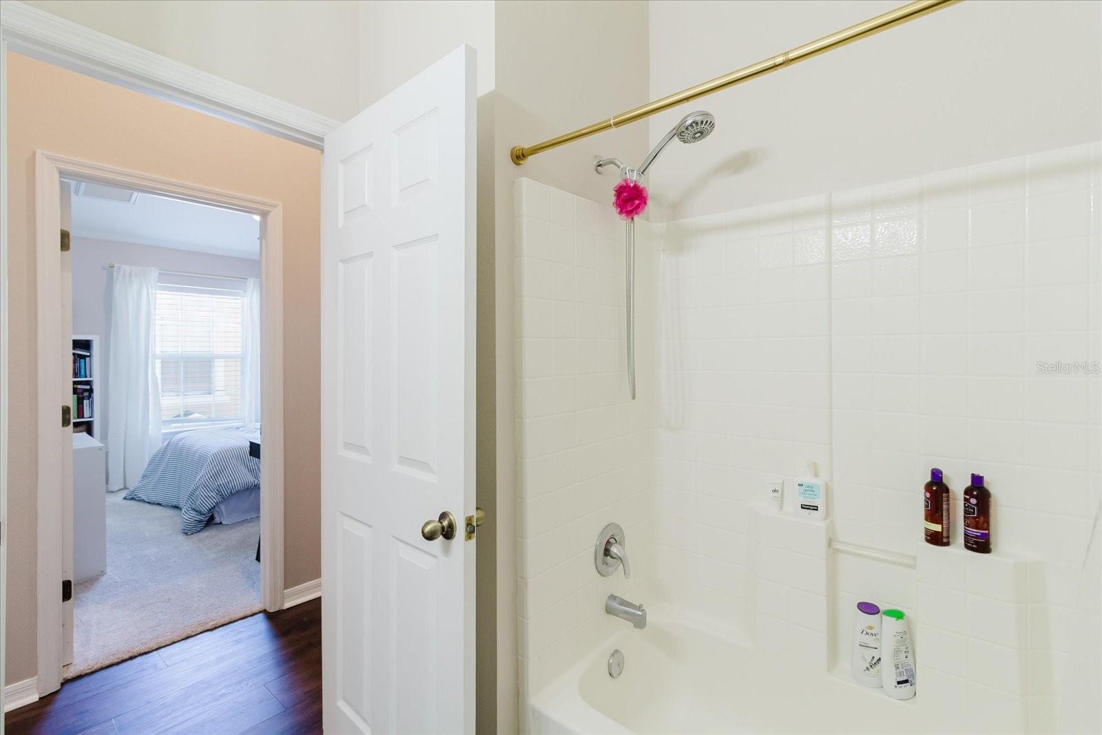 2nd Upstairs Bath With A Single Granite Counter Vanity, Luxury Vinyl Floors, & A Tub/Shower Combo