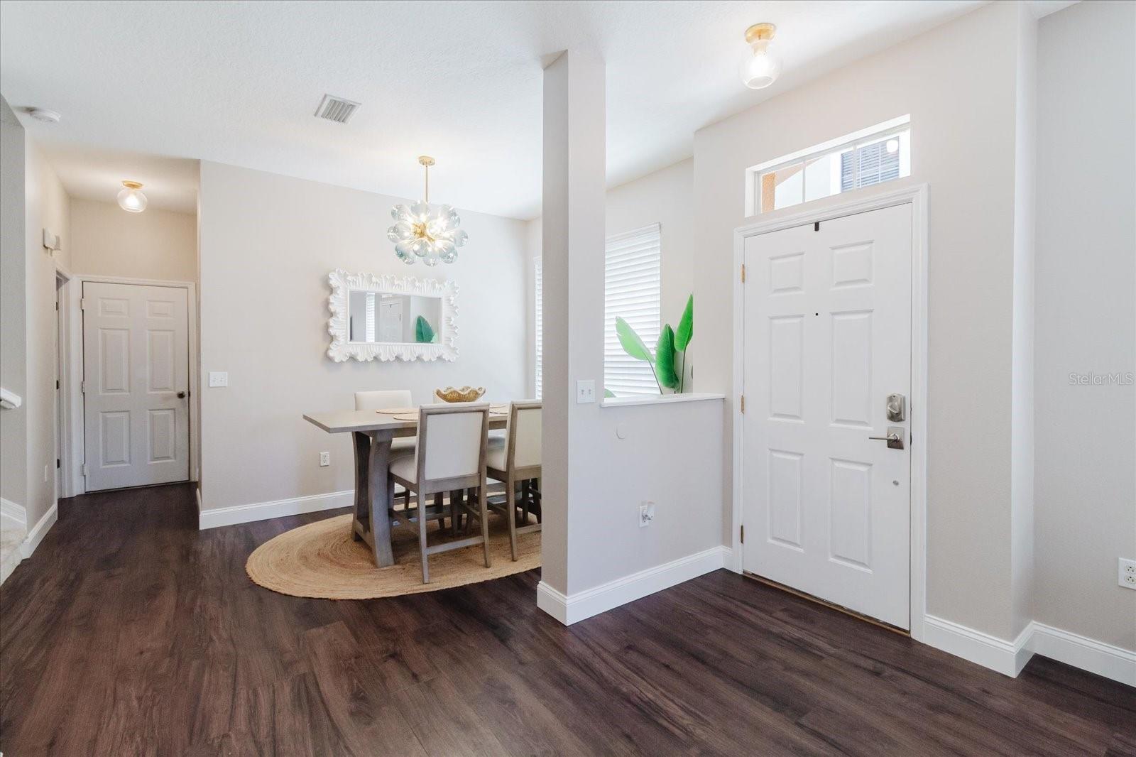 Foyer With The Dining Area. Beautiful Luxury Vinyl Floors and Fresh Paint