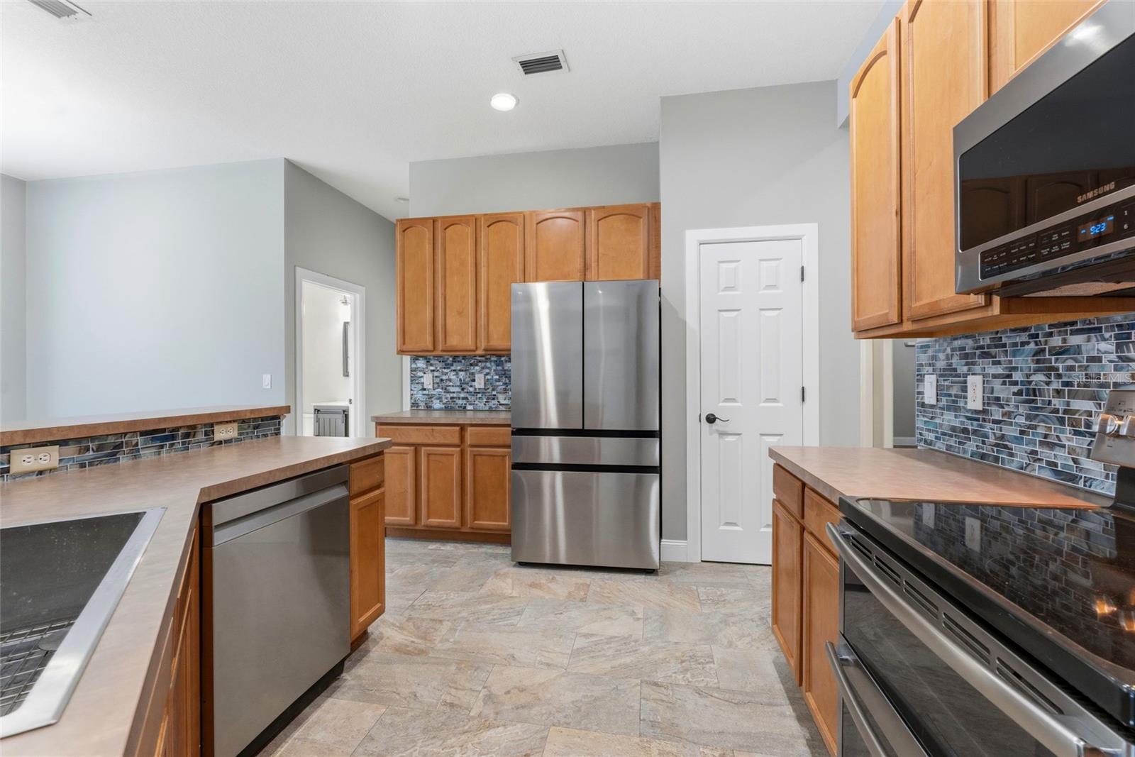 Kitchen features closet pantry, Refrigerator (2024), Dishwasher (2021), Oven (2019), Microwave (2021)