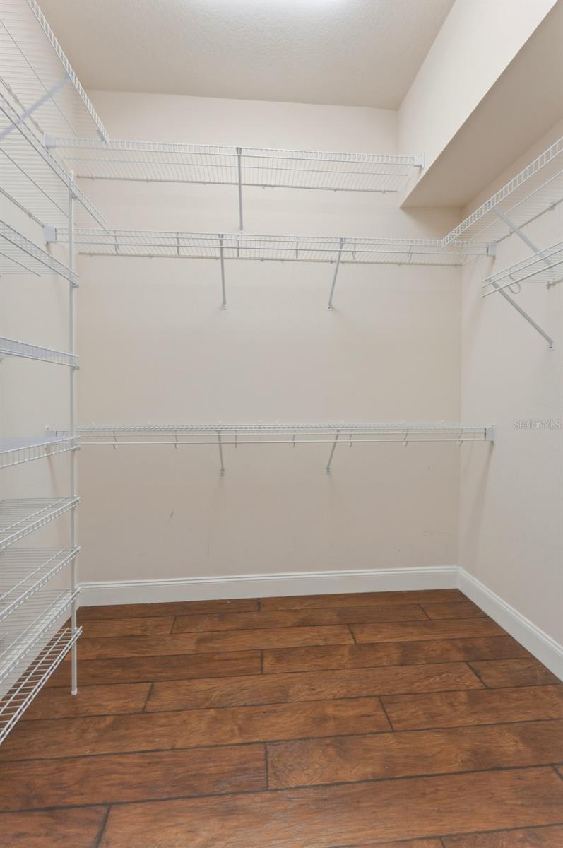 Primary bedroom has dual walk-in closets
