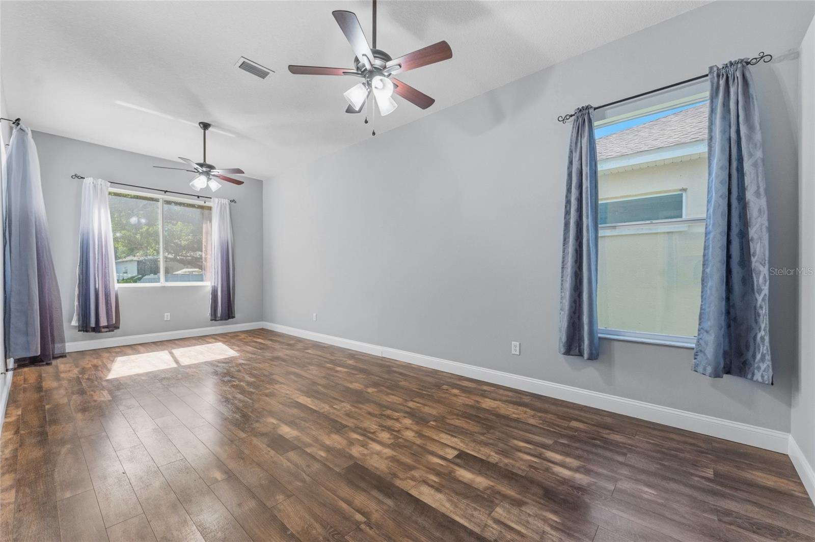 Large bonus room (23'x11') on opposite wing of home from primary bedroom