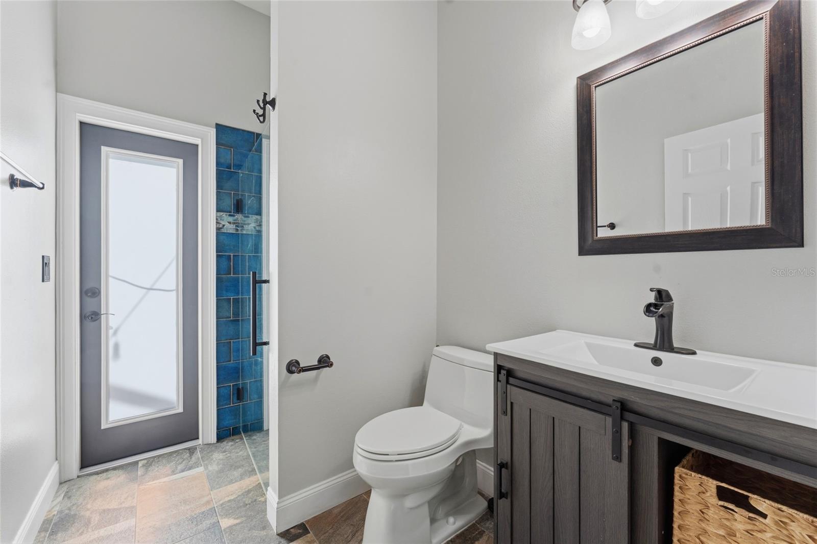 Bathroom 3. Pool bath with exterior door leading to pool and lania