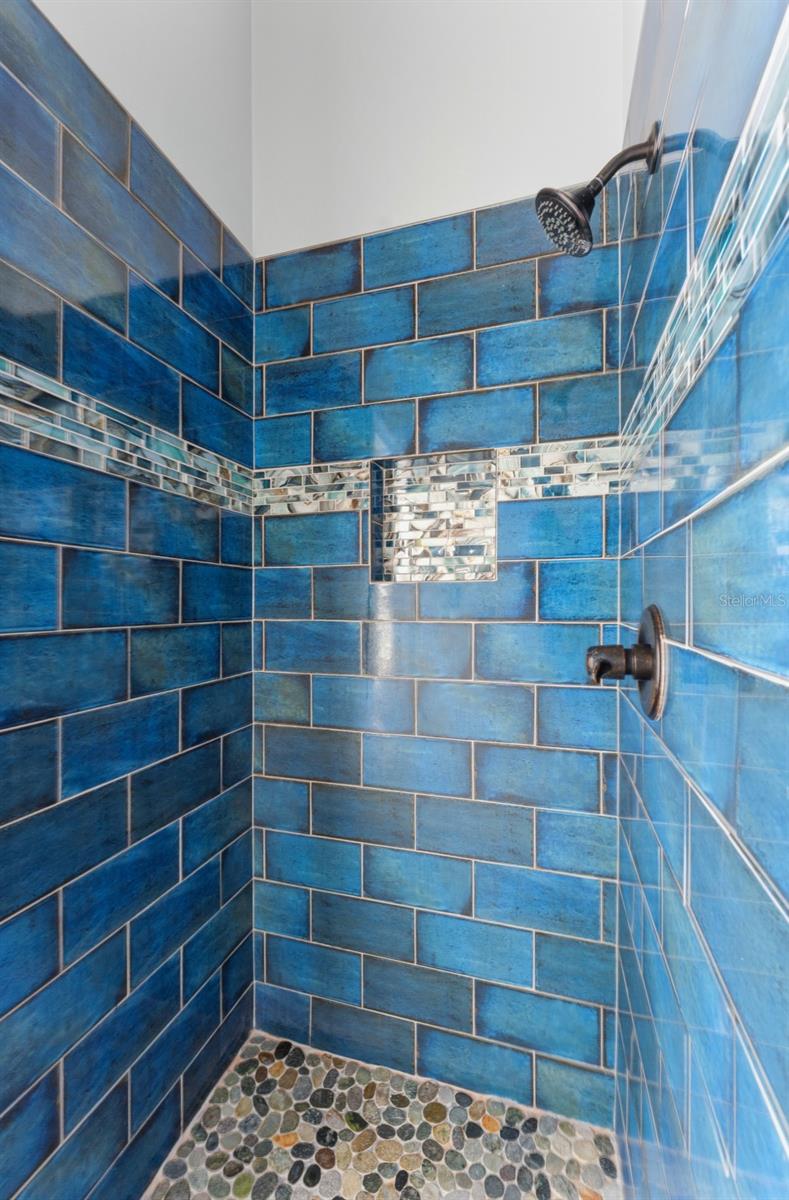 Bathroom 3 features tile shower