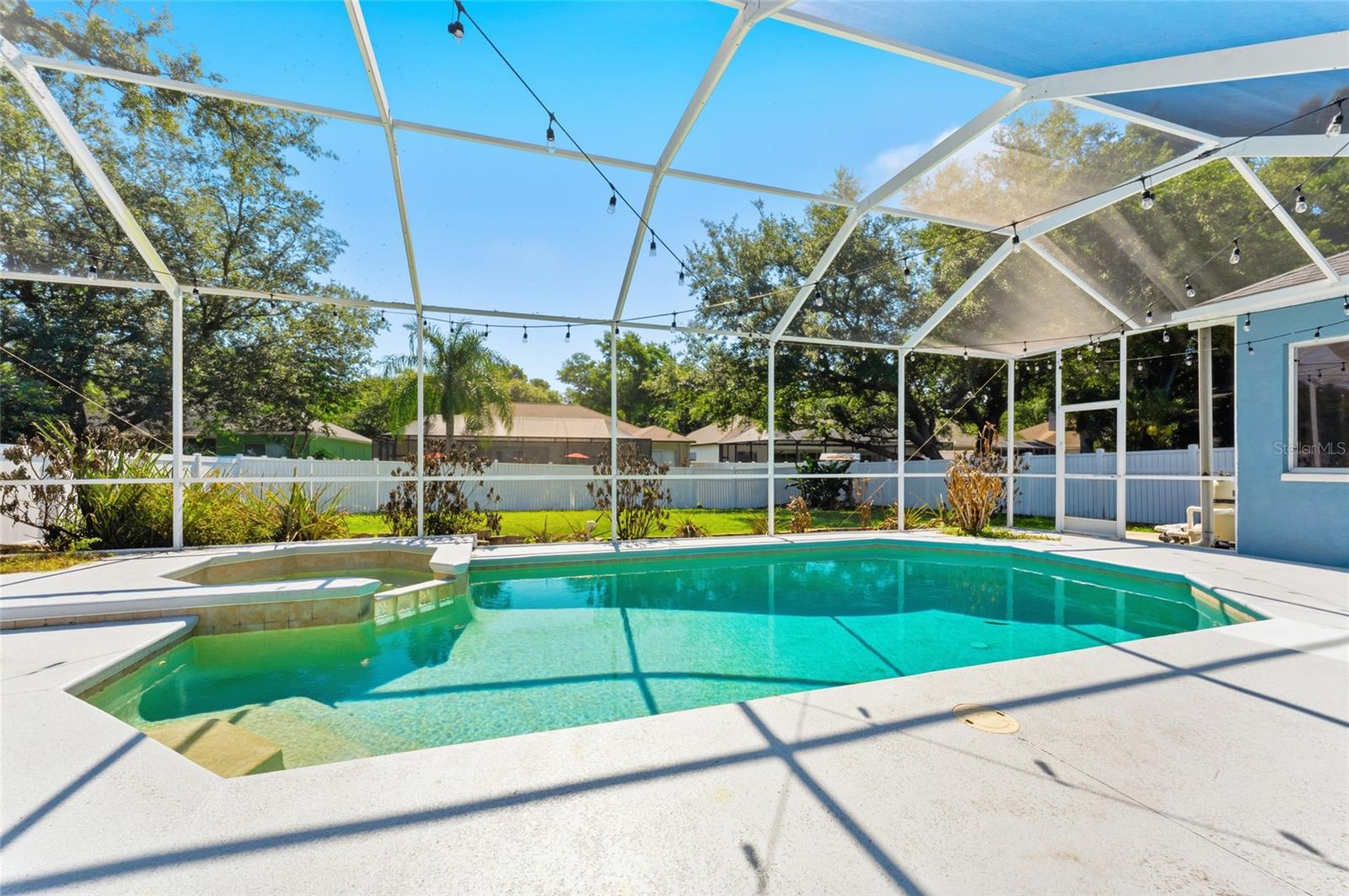 Pool measures 14'x28' and features a heated spillover spa