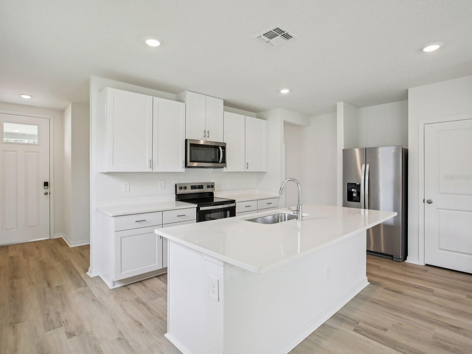 Interior photos are not of the actual home but are photos of the builder home with the same floorplan with similar interior finishes and features.