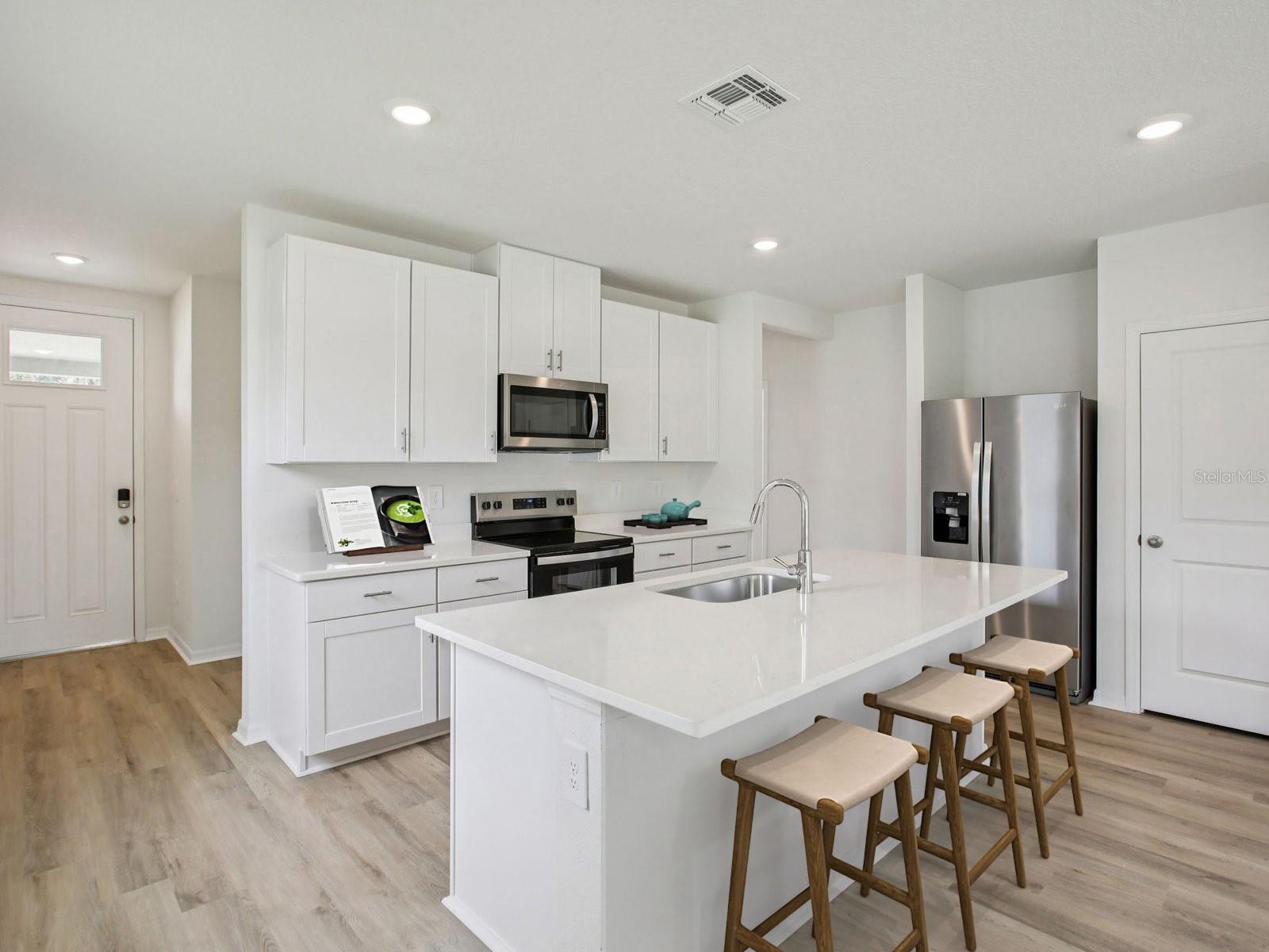 Interior photos are not of the actual home but are photos of the builder home with same floorplan with similar interior finishes and features. Photo uses virtual staging.