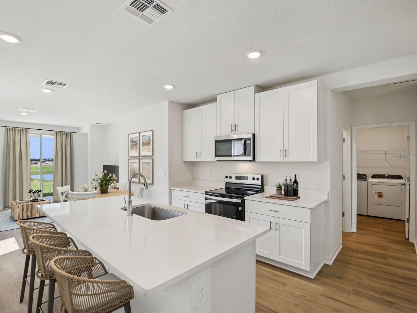 Interior photos are not of the actual home but are photos of the builder home with same floorplan with similar interior finishes and features. Photo uses virtual staging.