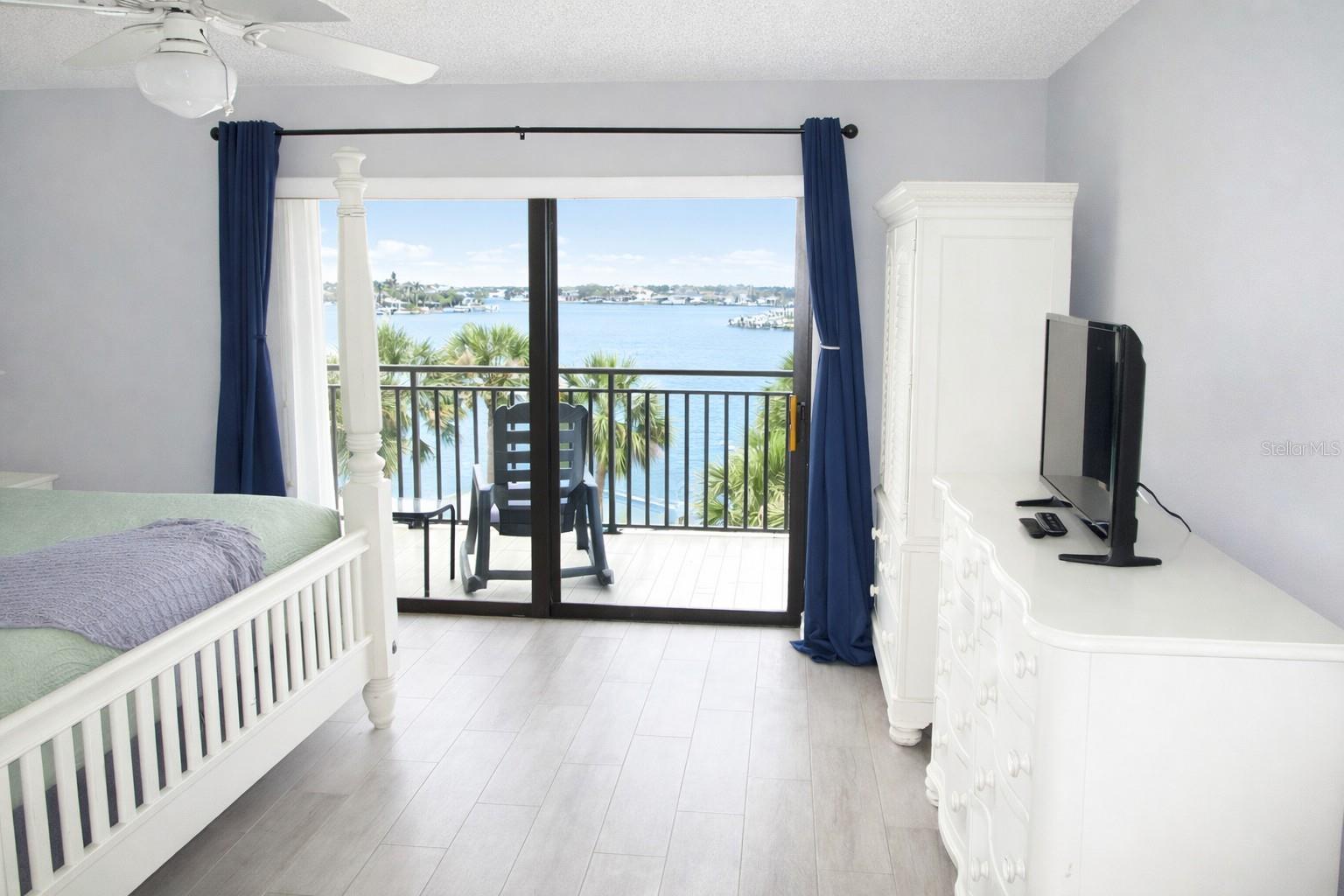 Primary Bedroom with entrance to balcony.