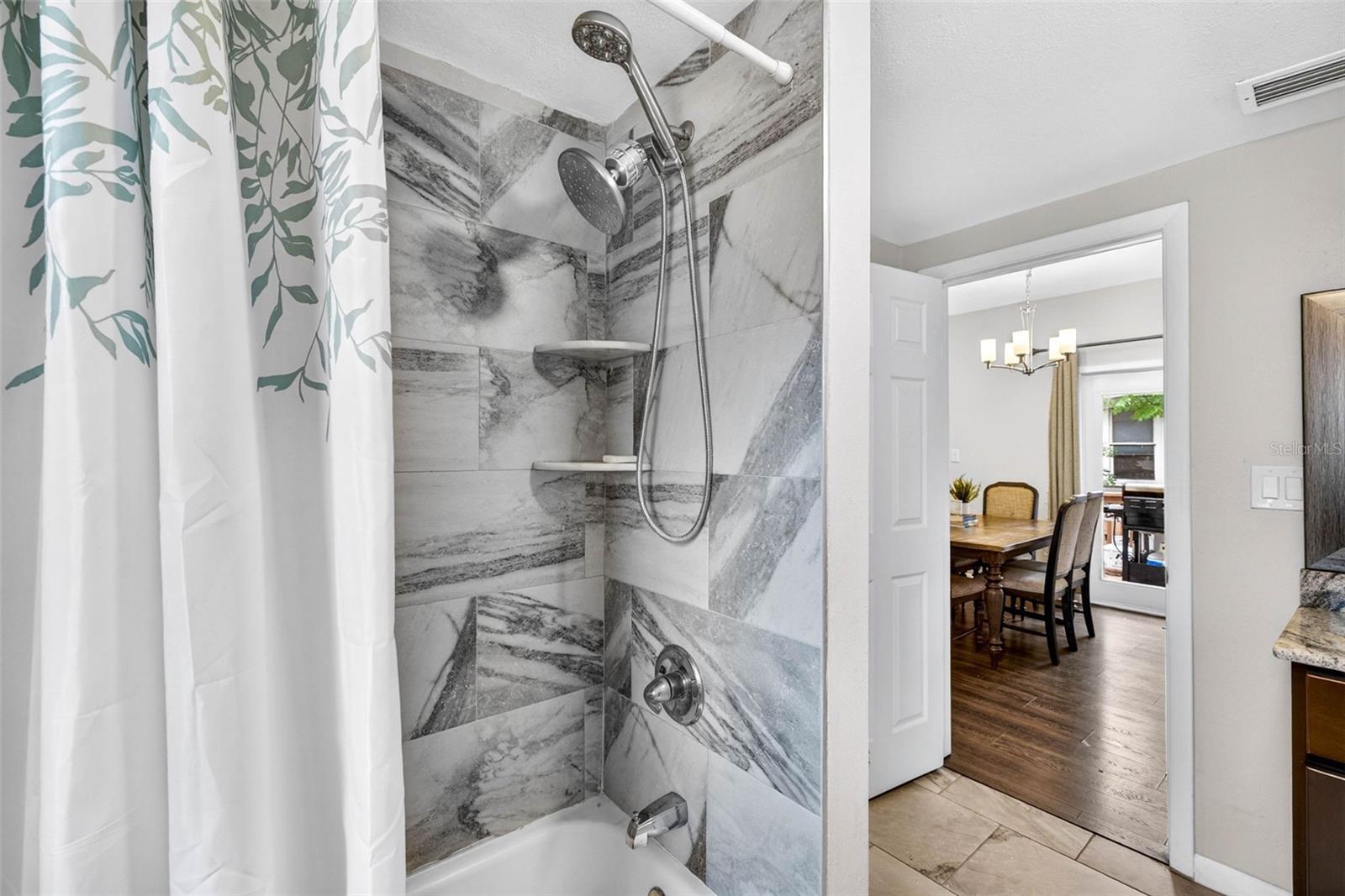 Floor to ceiling tiled guest shower
