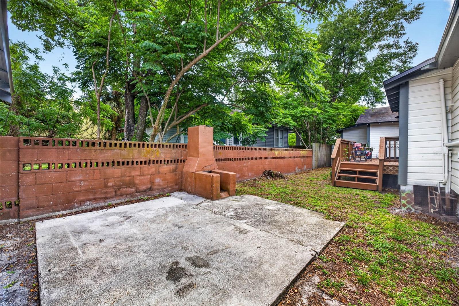 back yard with concrete pad for pergola