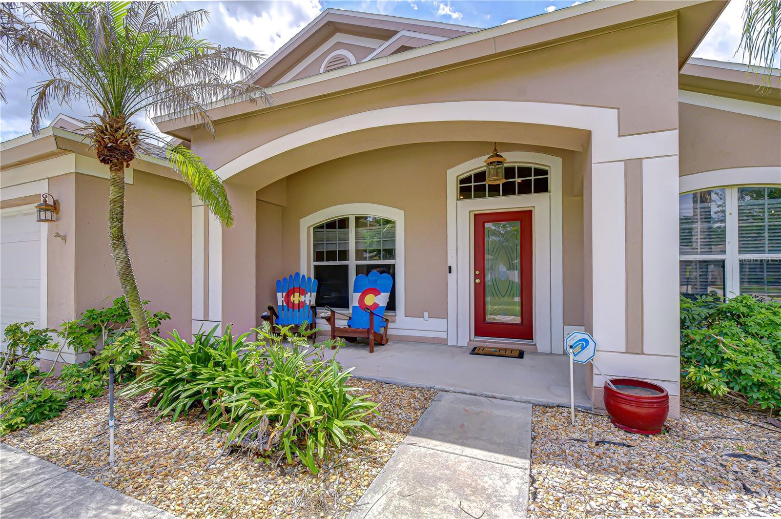 Inviting front entry with classic Florida charm