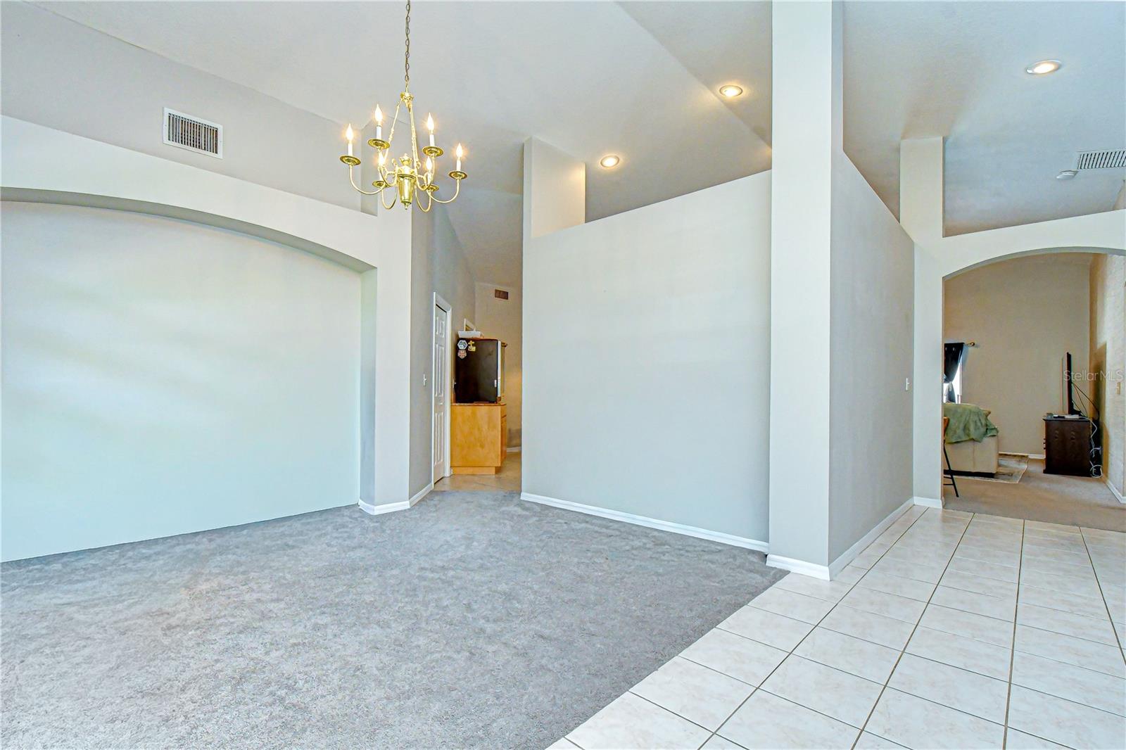 Enter through the front doors into an open foyer with volume ceiling!