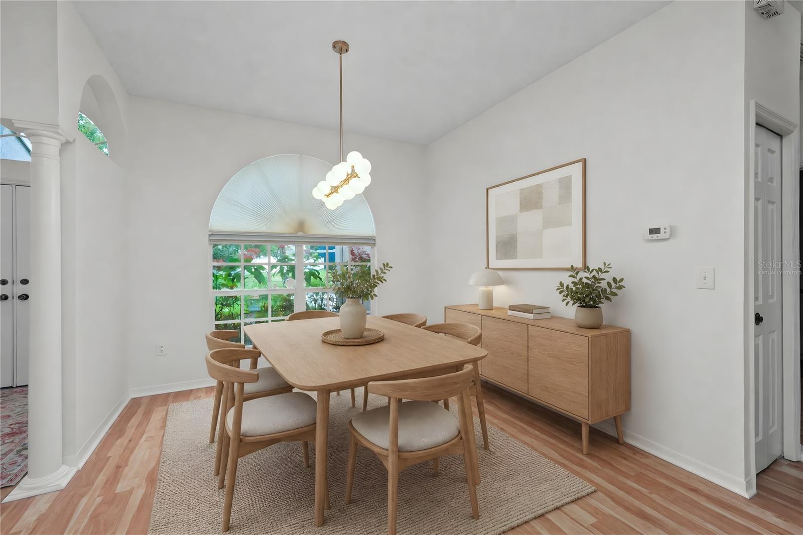 Virtually Staged - Dining Room with New flooring and lighting