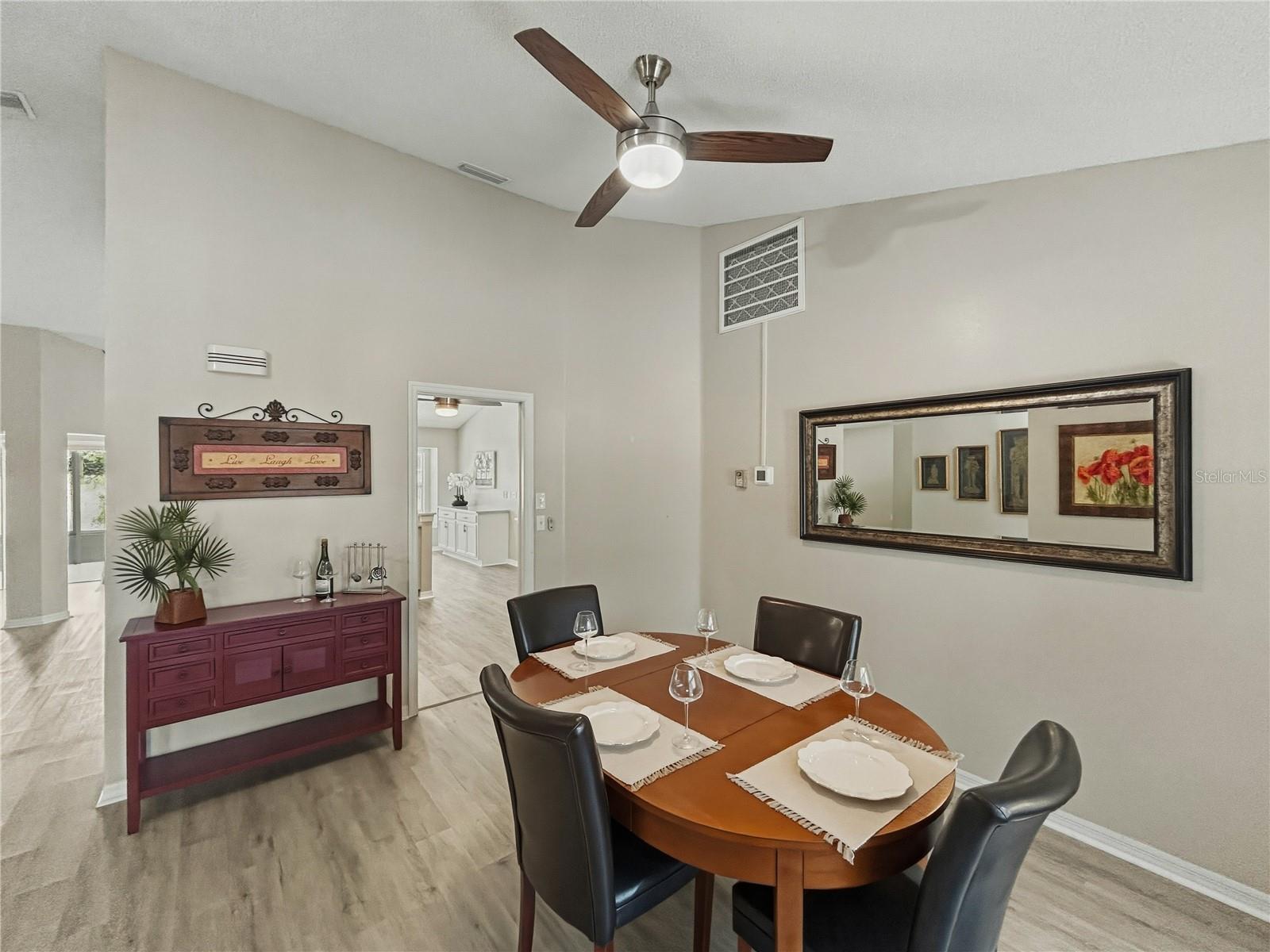 Upon entry, formal dining room on the front right of the home with vaulted ceilings and much natural lighting